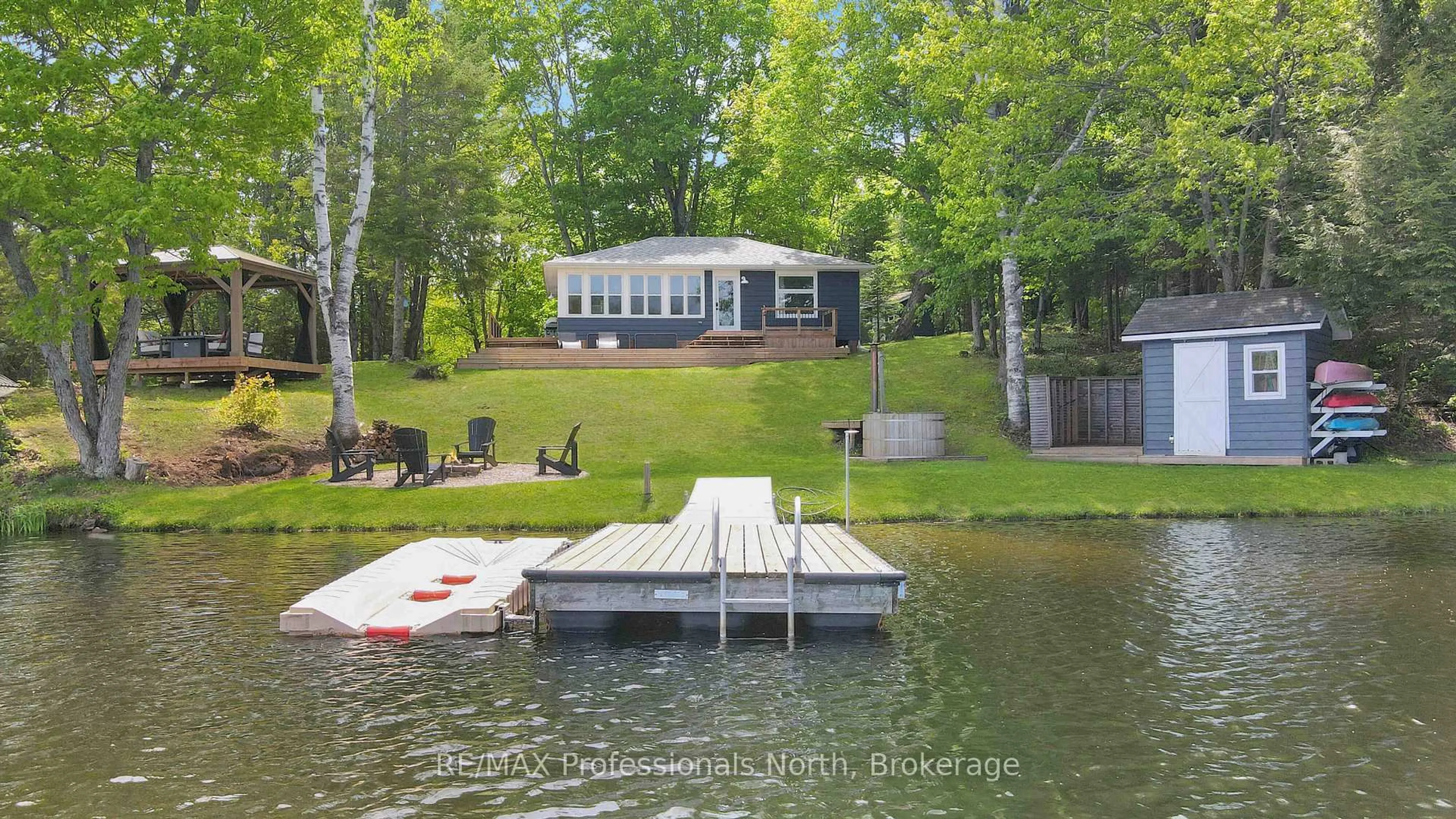 A pic from outside/outdoor area/front of a property/back of a property/a pic from drone, water/lake/river/ocean view for 1114 Comfort Dr, Highlands East Ontario K0M 1R0