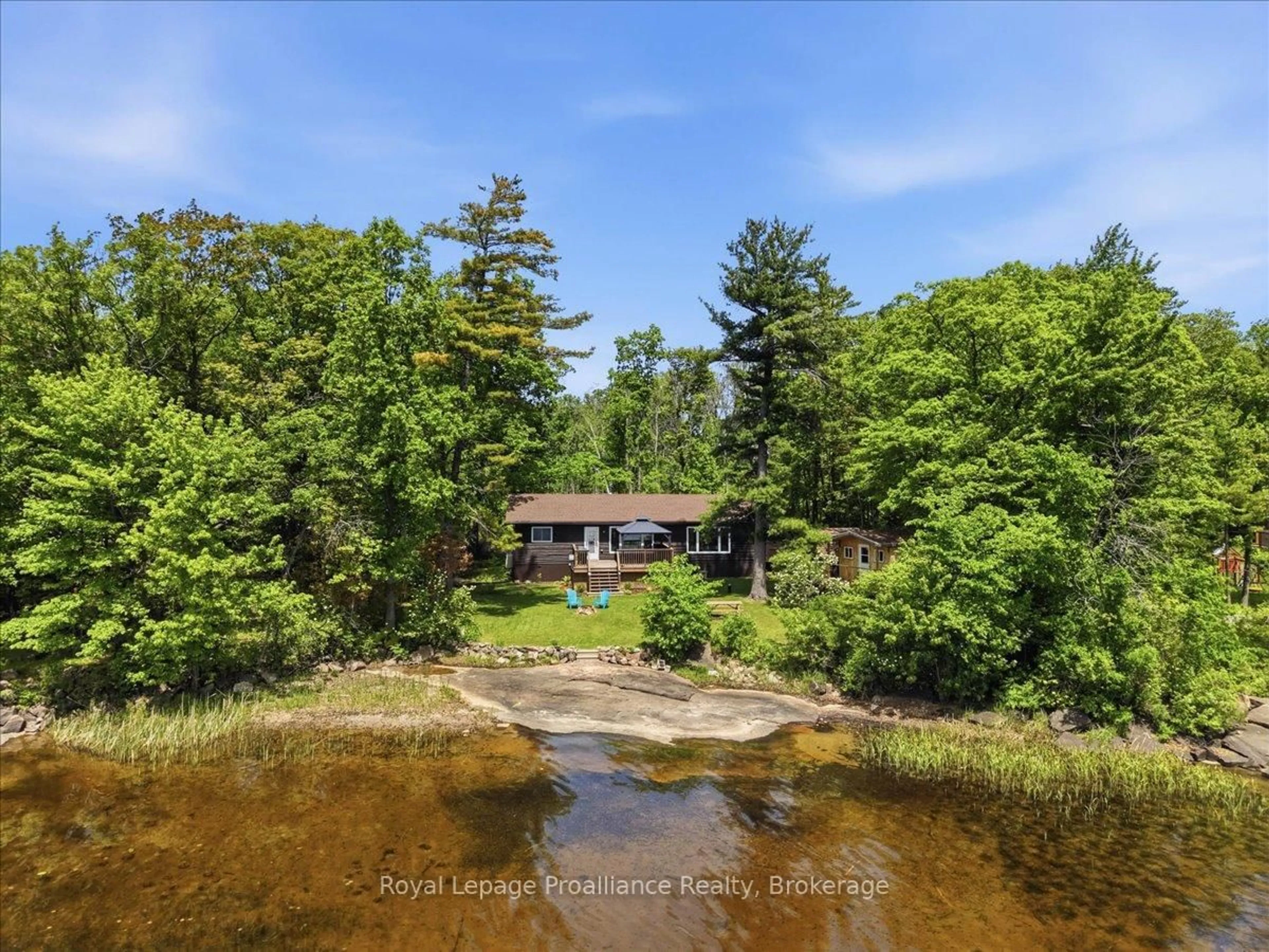 A pic from outside/outdoor area/front of a property/back of a property/a pic from drone, water/lake/river/ocean view for 304 Lakeview Lane, Tweed Ontario K0K 3J0