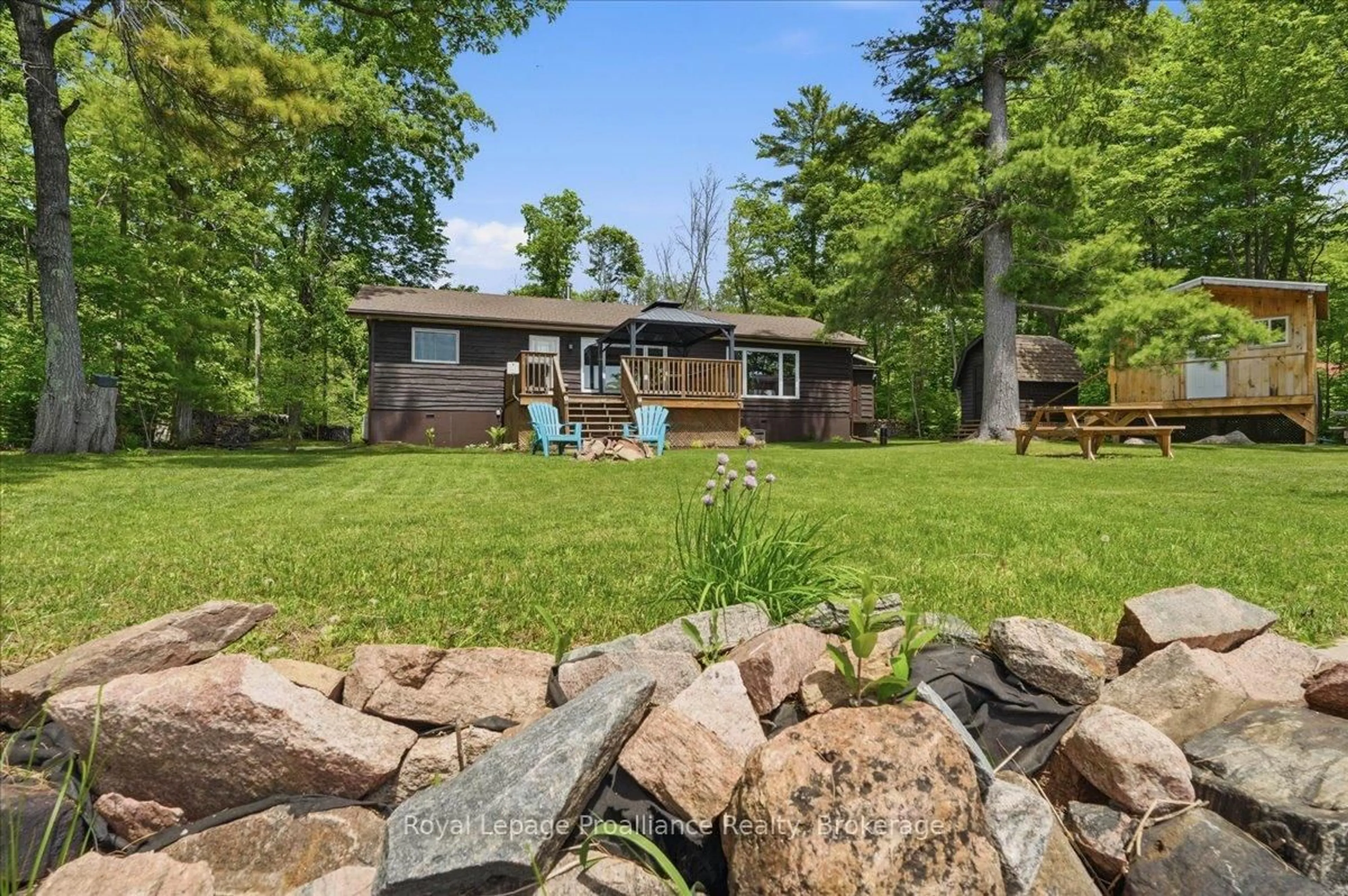 A pic from outside/outdoor area/front of a property/back of a property/a pic from drone, water/lake/river/ocean view for 304 Lakeview Lane, Tweed Ontario K0K 3J0