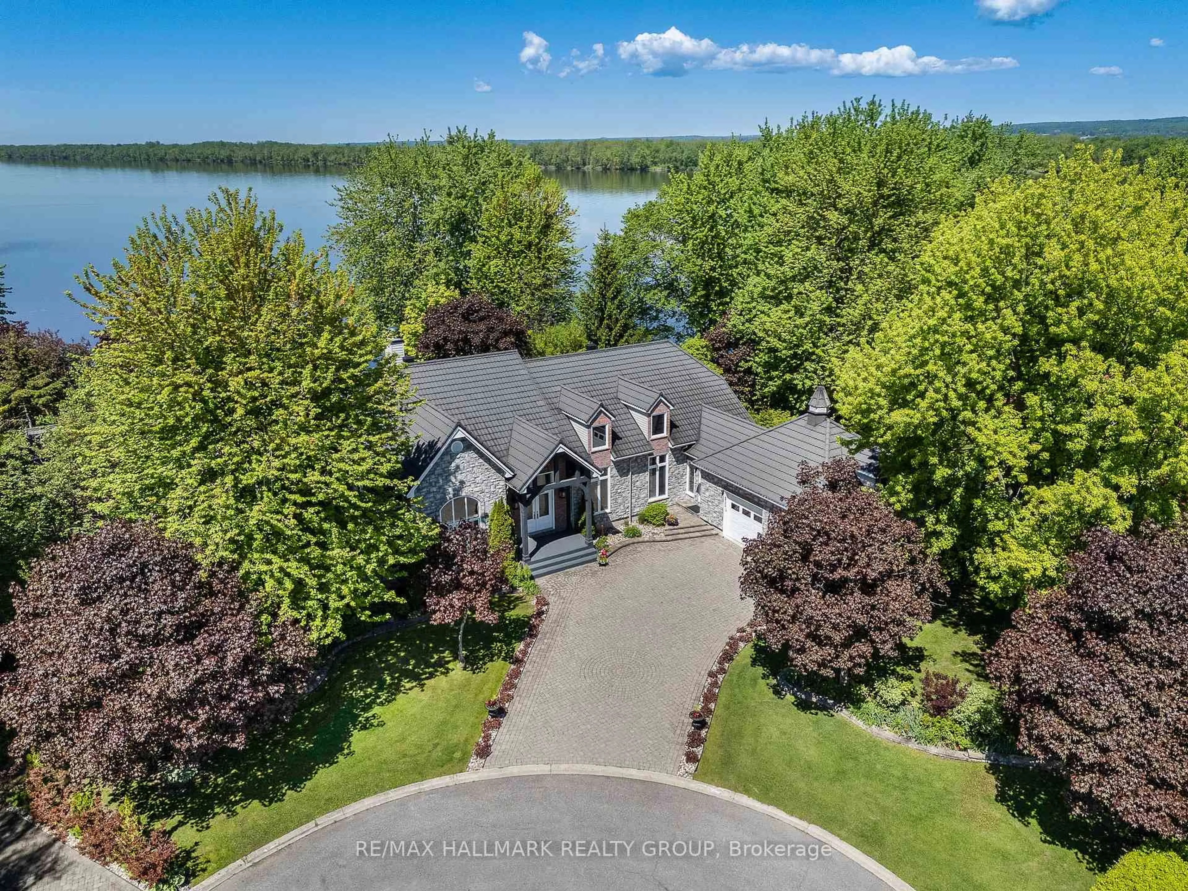 A pic from outside/outdoor area/front of a property/back of a property/a pic from drone, water/lake/river/ocean view for 2584 WOODS St, Clarence-Rockland Ontario K4K 1J2