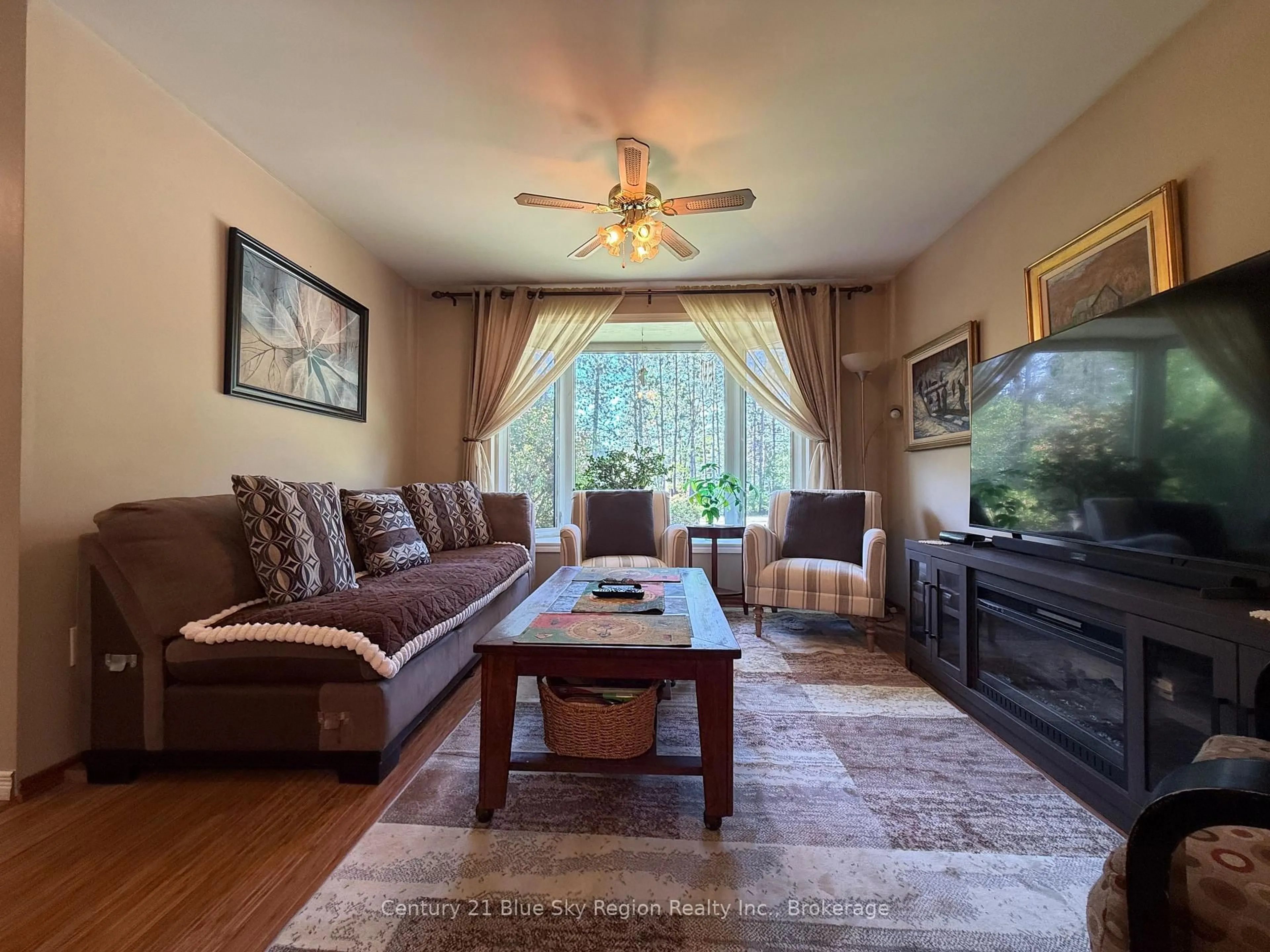 Living room with furniture, wood/laminate floor for 108 Dalys Rd, North Bay Ontario P1B 8G4
