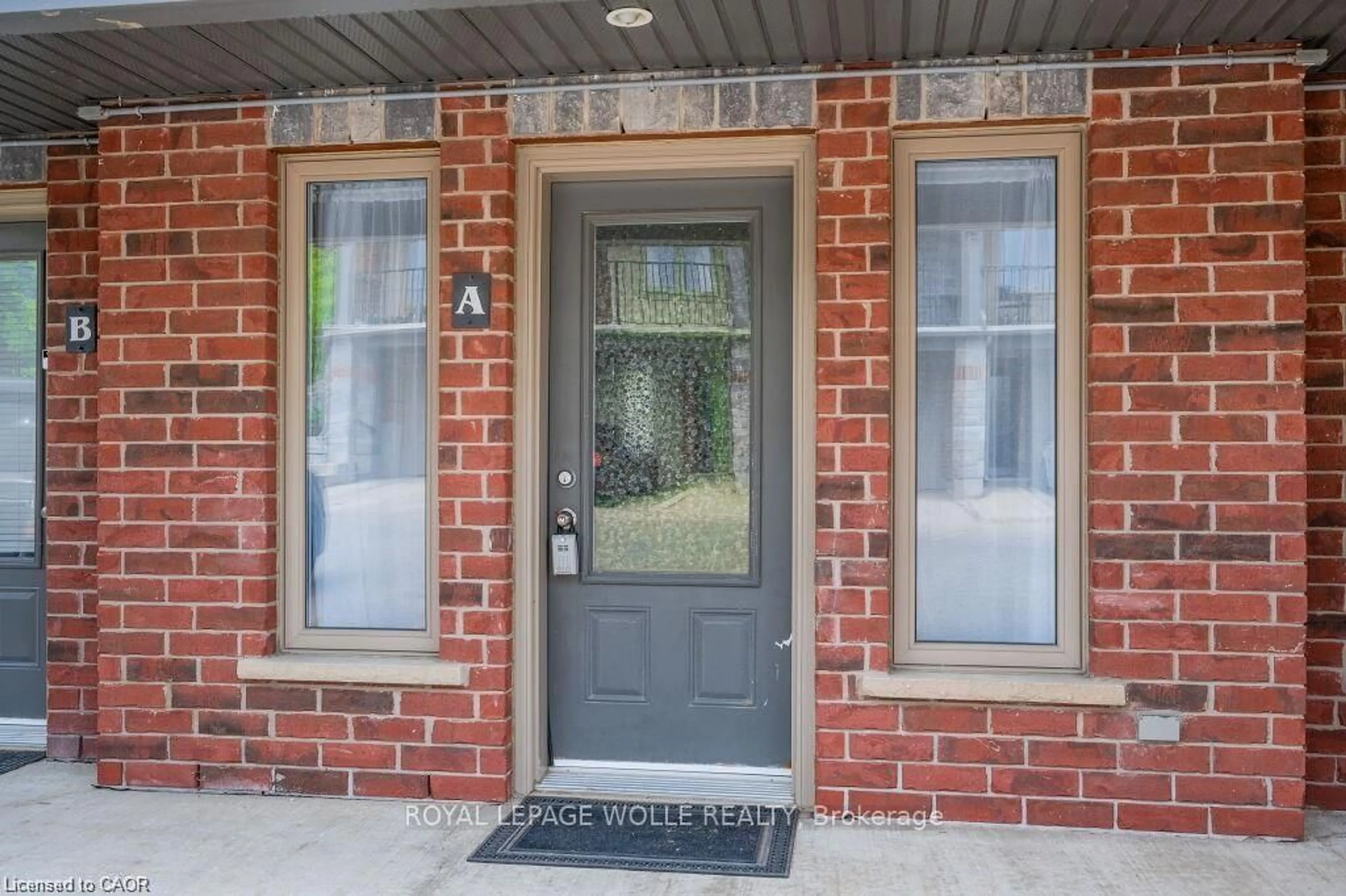 Home with brick exterior material, street for 489 East Ave #A, Kitchener Ontario N2H 0A8