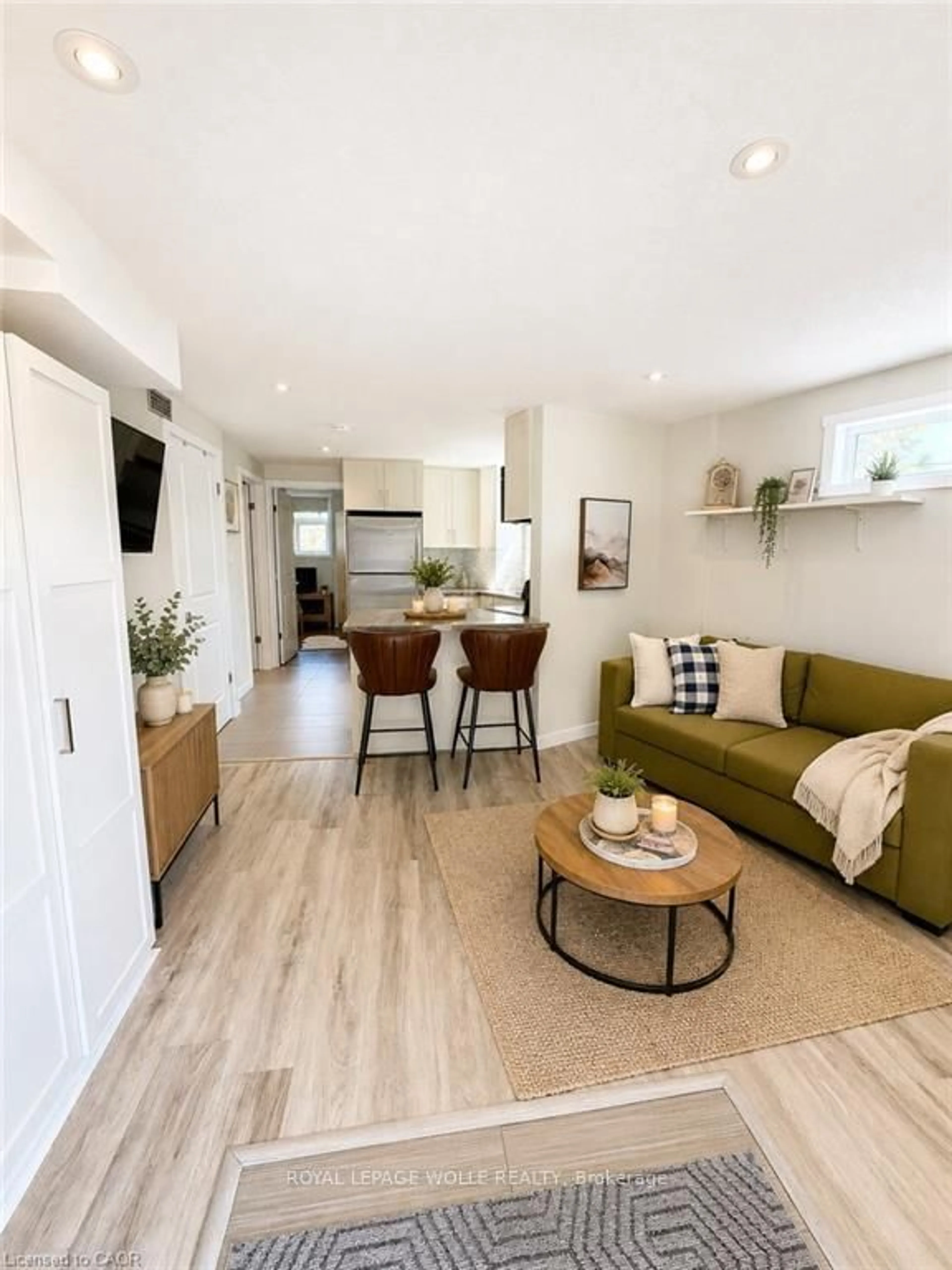 Living room with furniture, wood/laminate floor for 489 East Ave #A, Kitchener Ontario N2H 0A8