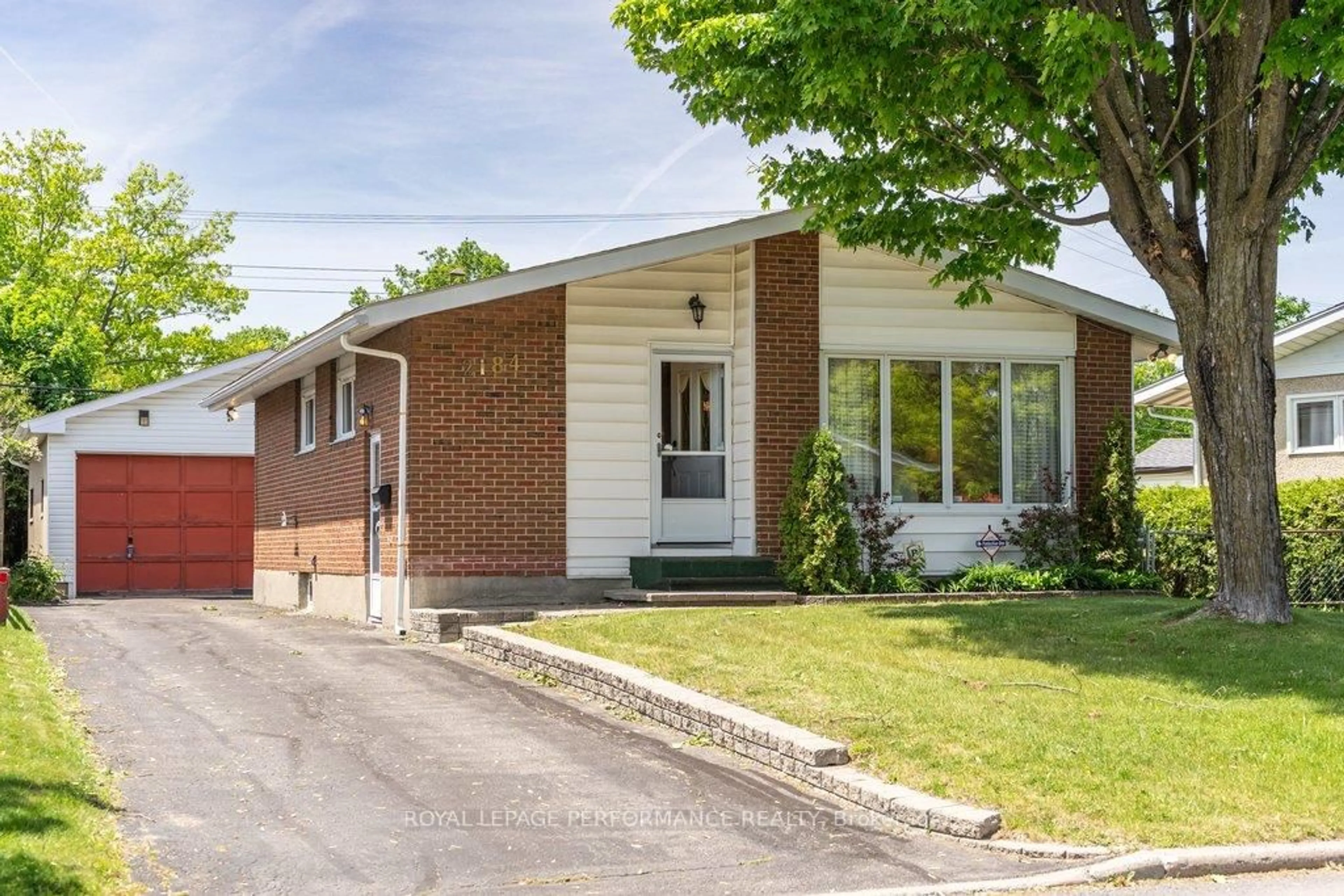 Home with brick exterior material, street for 2184 Melfort St, Ottawa Ontario K1G 1H7