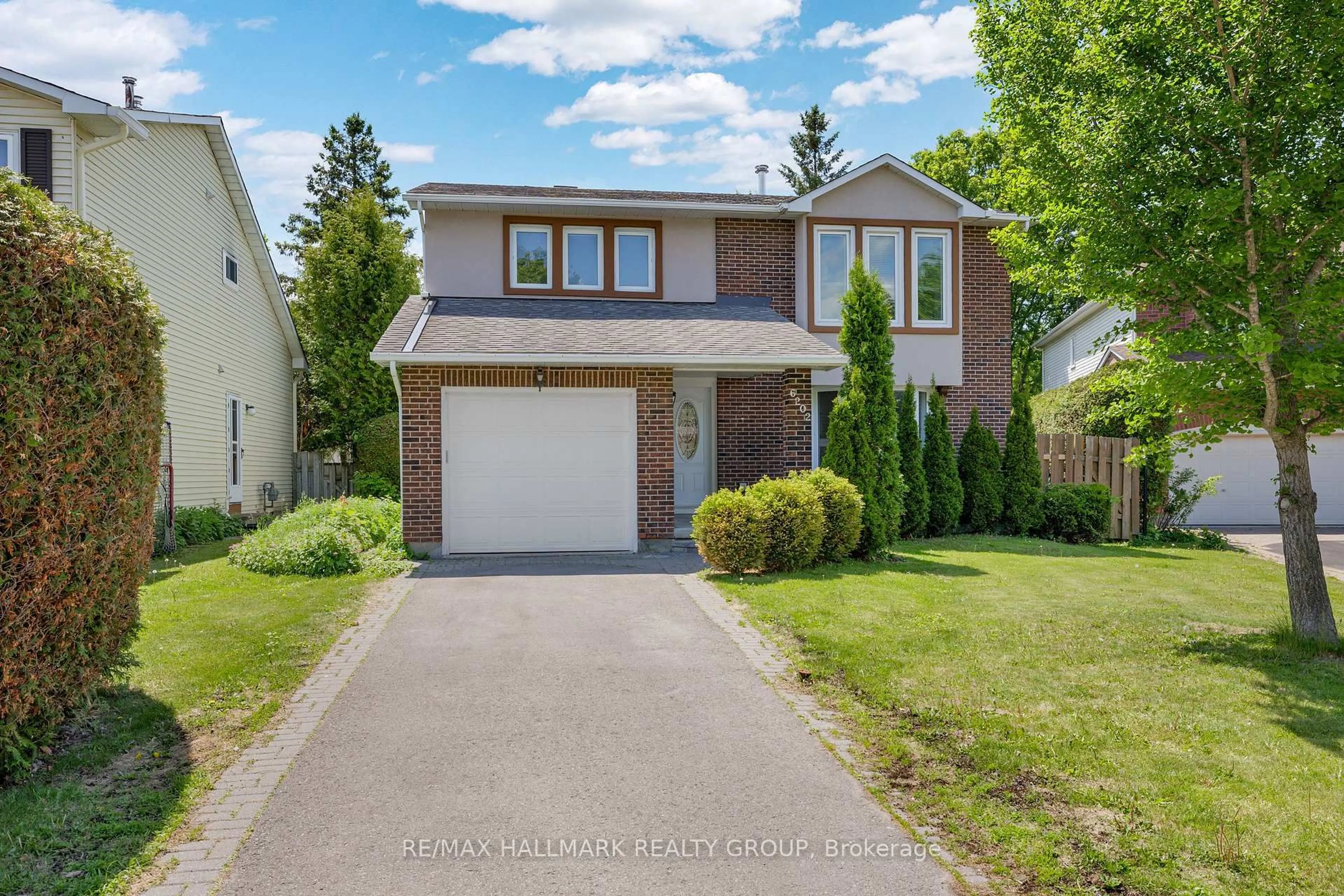 Home with vinyl exterior material, street for 6202 Ravine Way, Orleans Ontario K1C 2W4