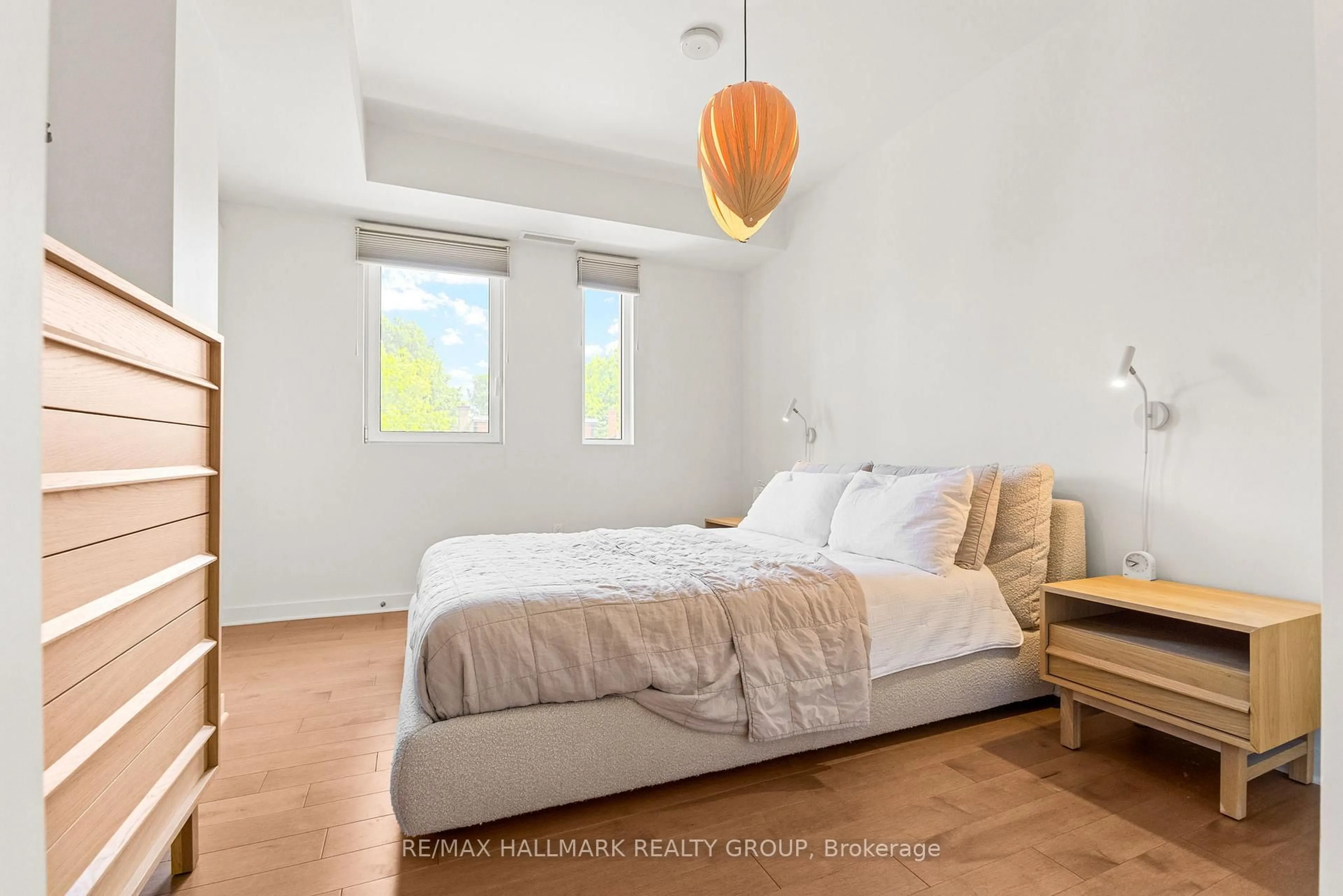 Bedroom with bed, wood/laminate floor for 135 Barrette St #207, Ottawa Ontario K1L 7Z9