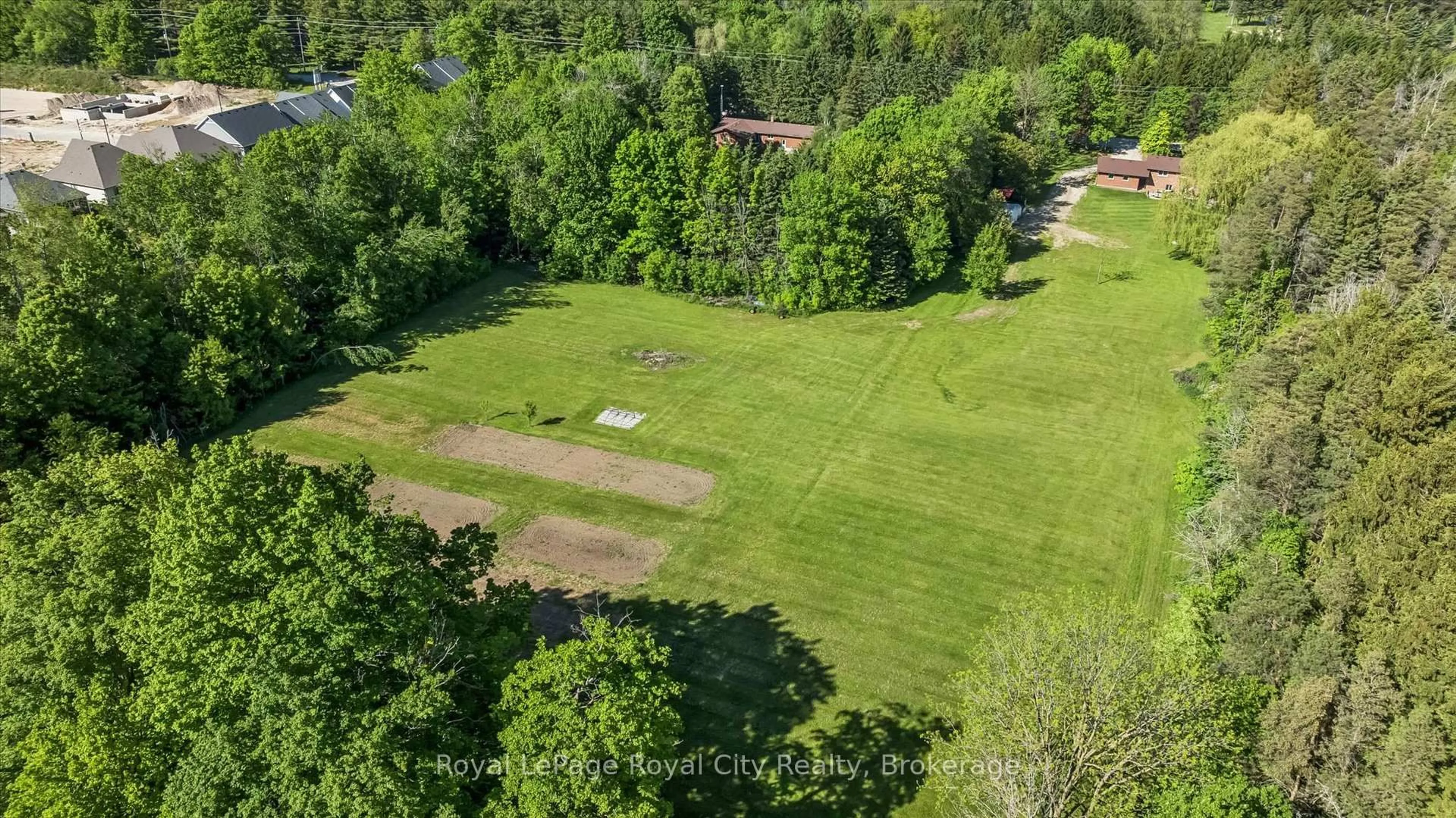 A pic from outside/outdoor area/front of a property/back of a property/a pic from drone, forest/trees view for 103 Gilkison St, Centre Wellington Ontario N0B 1S0
