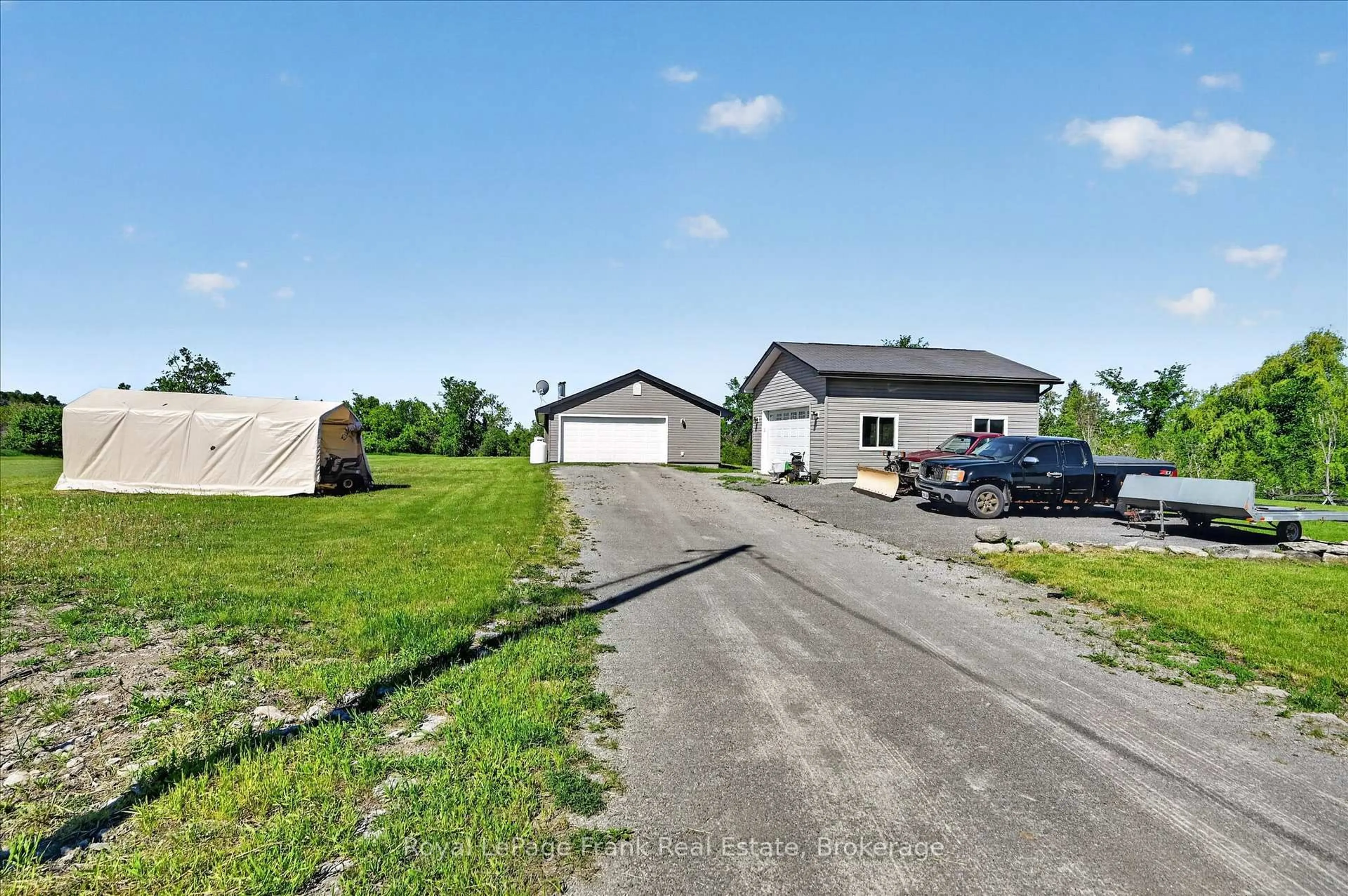 A pic from outside/outdoor area/front of a property/back of a property/a pic from drone, street for 394 7th Line Rd, Douro-Dummer Ontario K0L 2V9