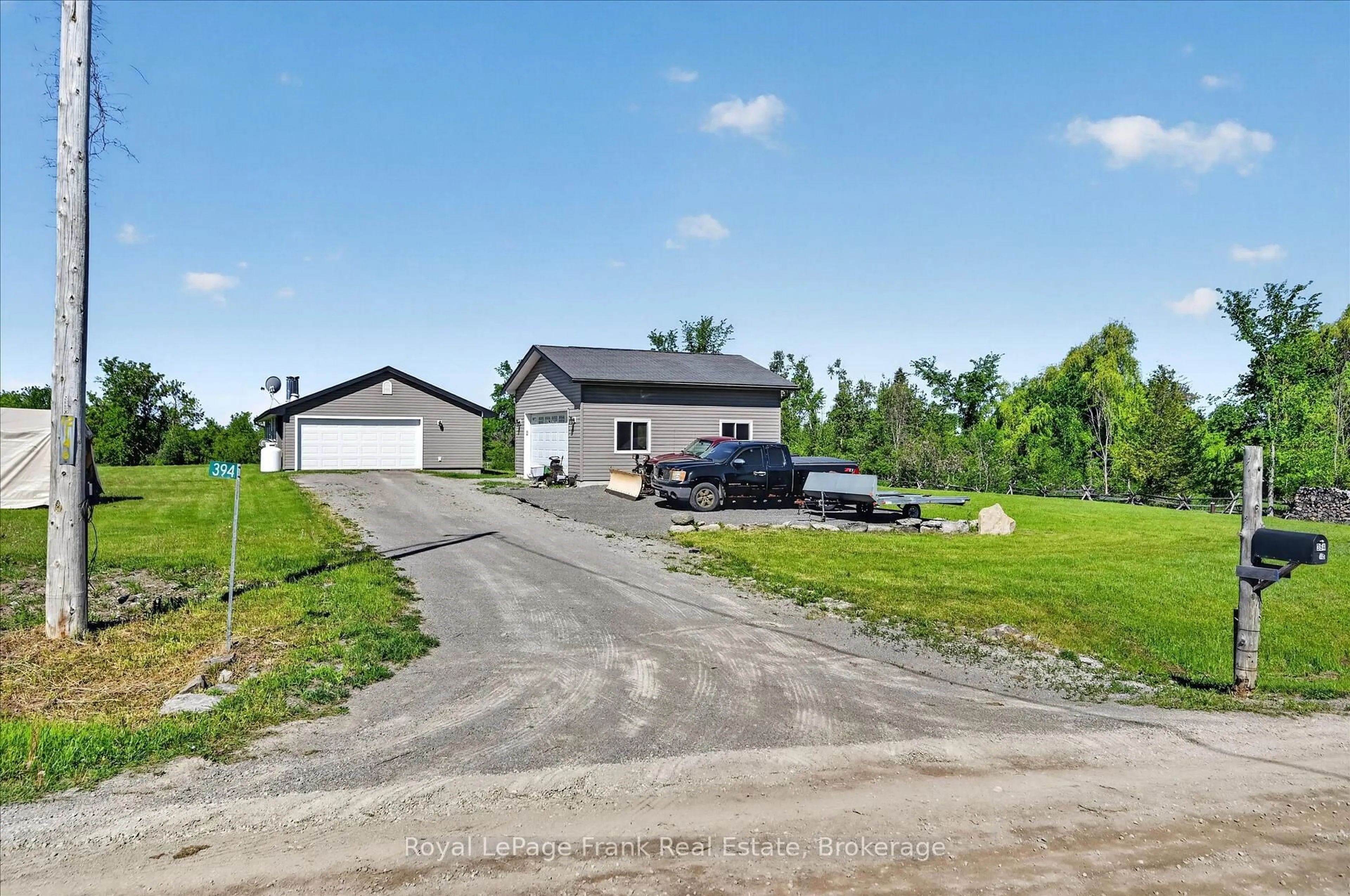 A pic from outside/outdoor area/front of a property/back of a property/a pic from drone, street for 394 7th Line Rd, Douro-Dummer Ontario K0L 2V9