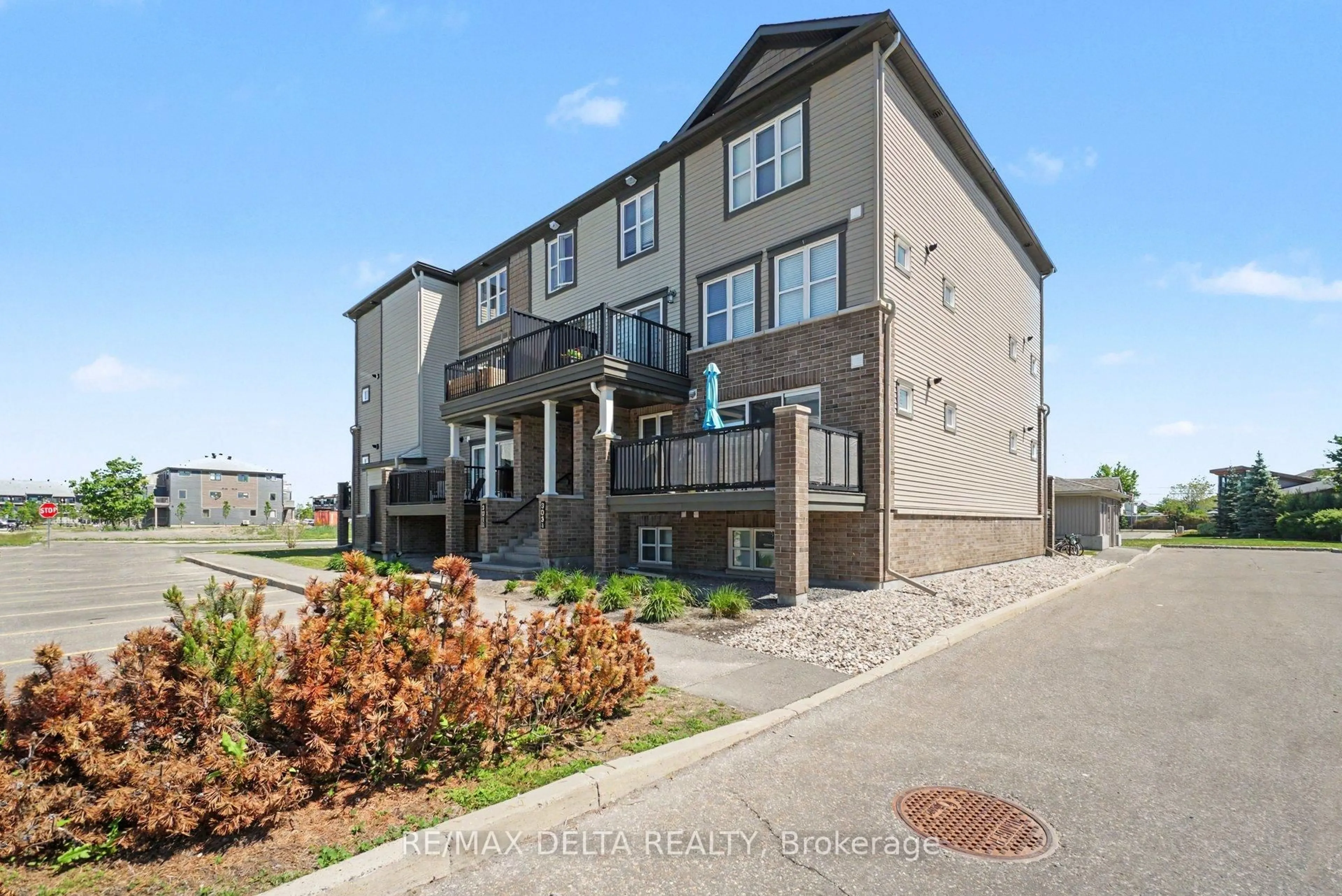 A pic from outside/outdoor area/front of a property/back of a property/a pic from drone, street for 301B Des Tilleuls Private #216, Ottawa Ontario K4A 1B7
