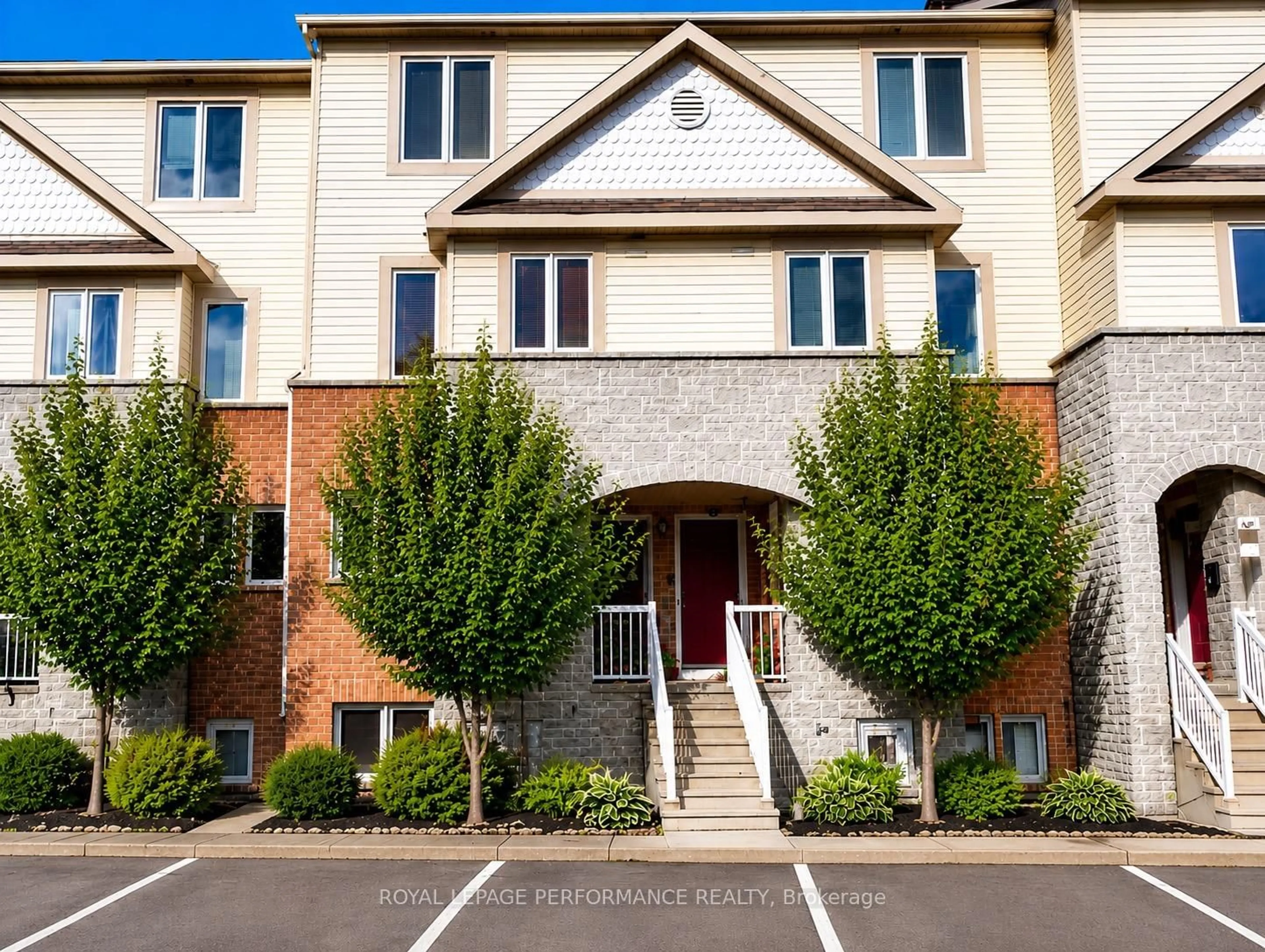 Home with brick exterior material, street for 59 Strathaven Private #33, Ottawa Ontario K1J 1K7