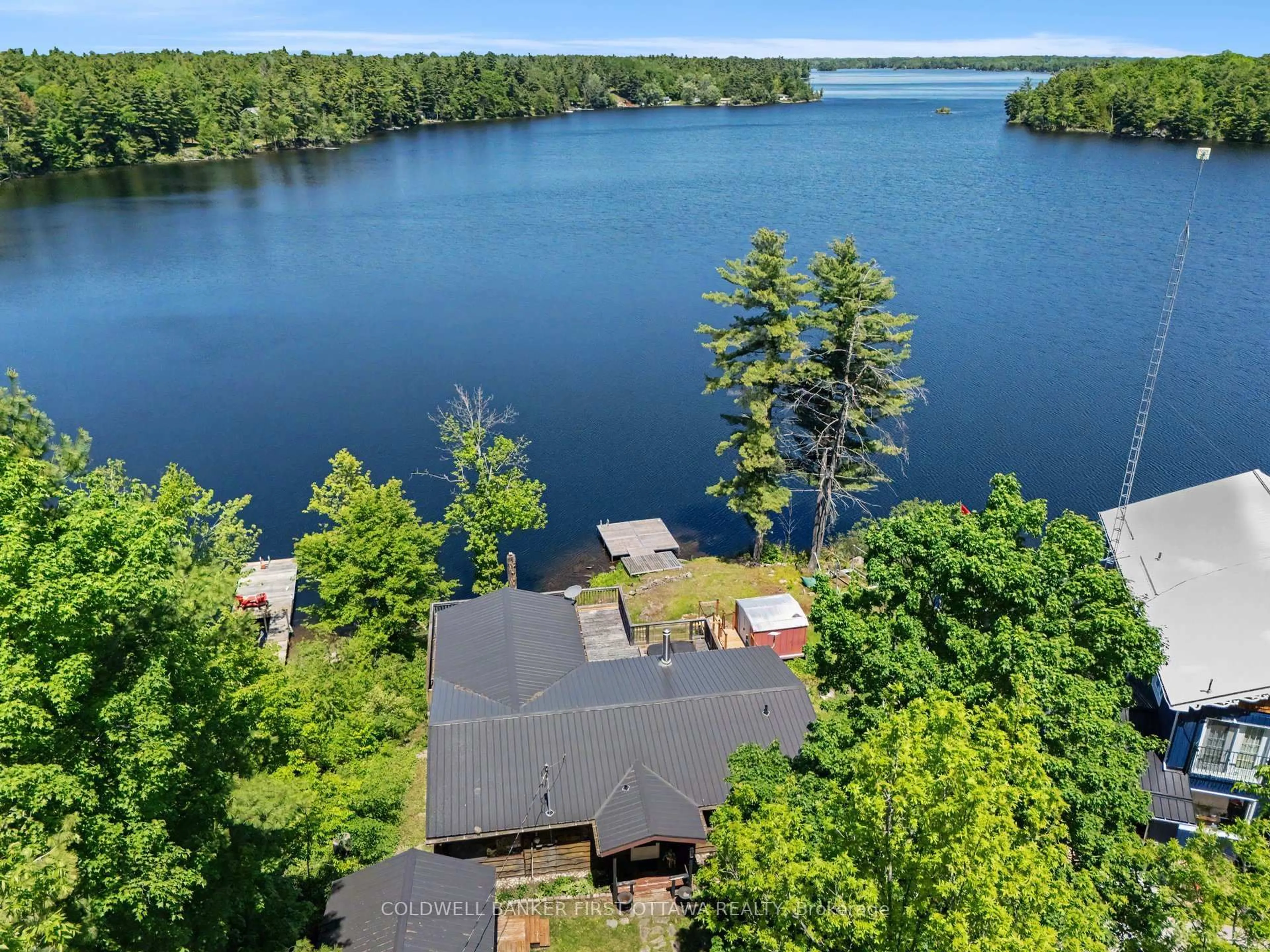 A pic from outside/outdoor area/front of a property/back of a property/a pic from drone, water/lake/river/ocean view for 1394 Black Lake North Shore, Perth Ontario K7H 3C5