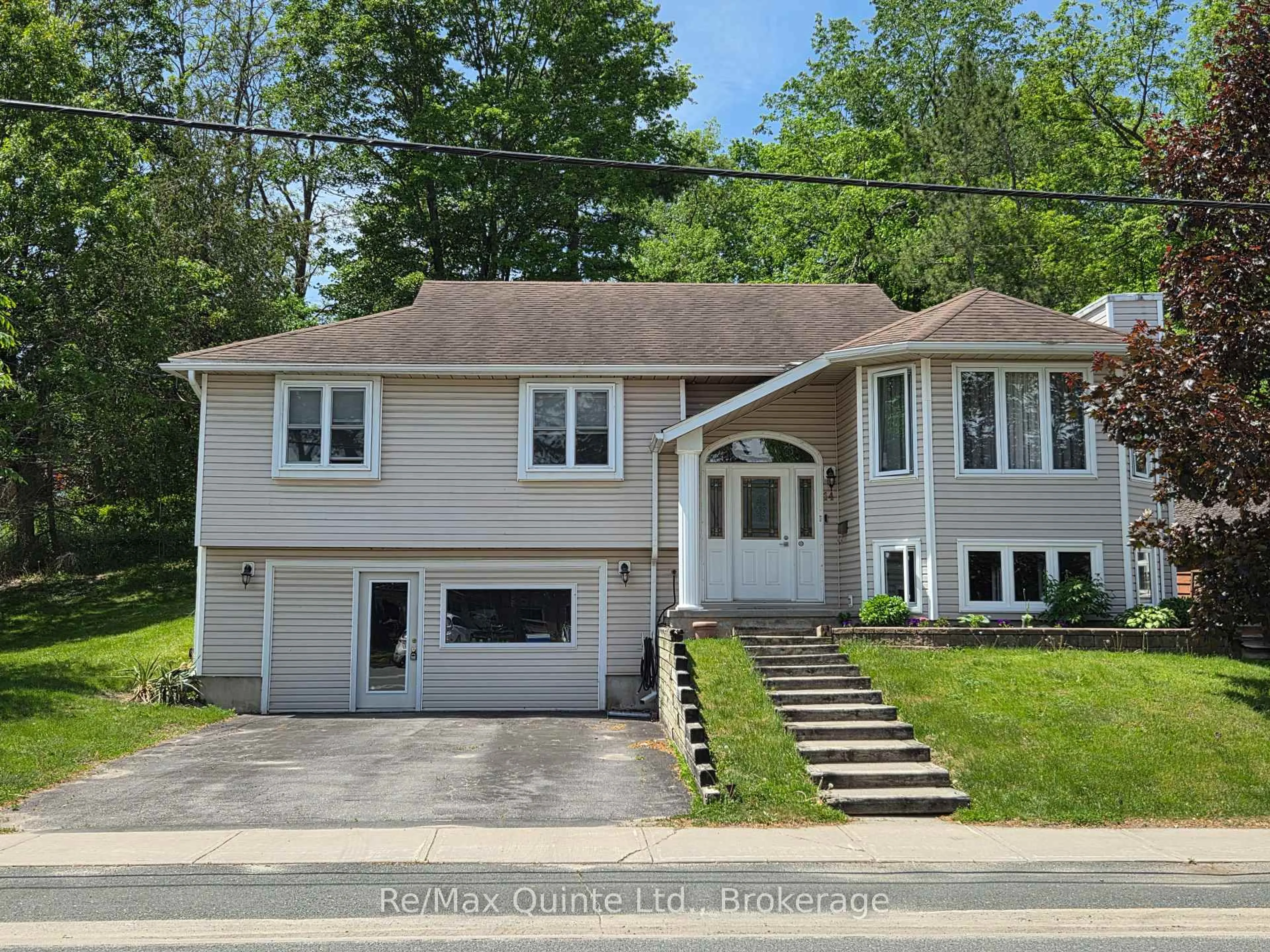 Home with vinyl exterior material, street for 14 McCamon Ave, Tweed Ontario K0K 3J0