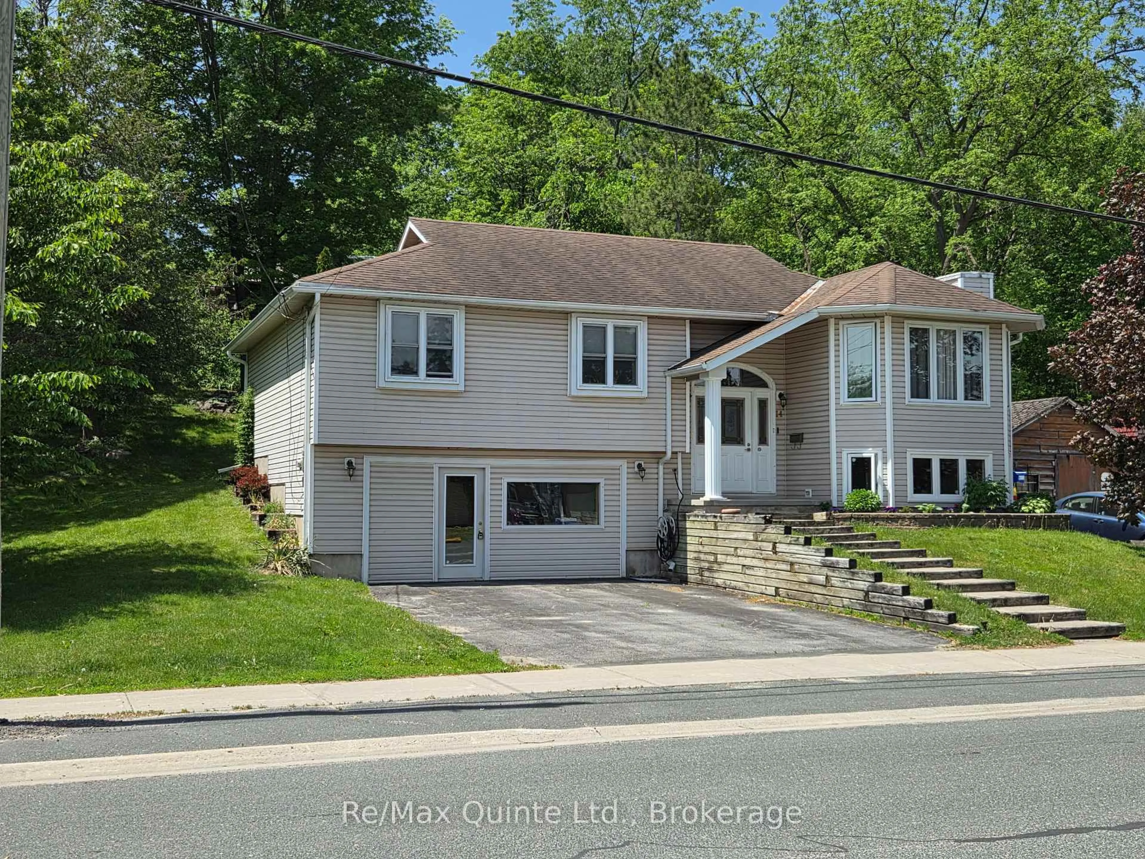 Home with vinyl exterior material, street for 14 McCamon Ave, Tweed Ontario K0K 3J0