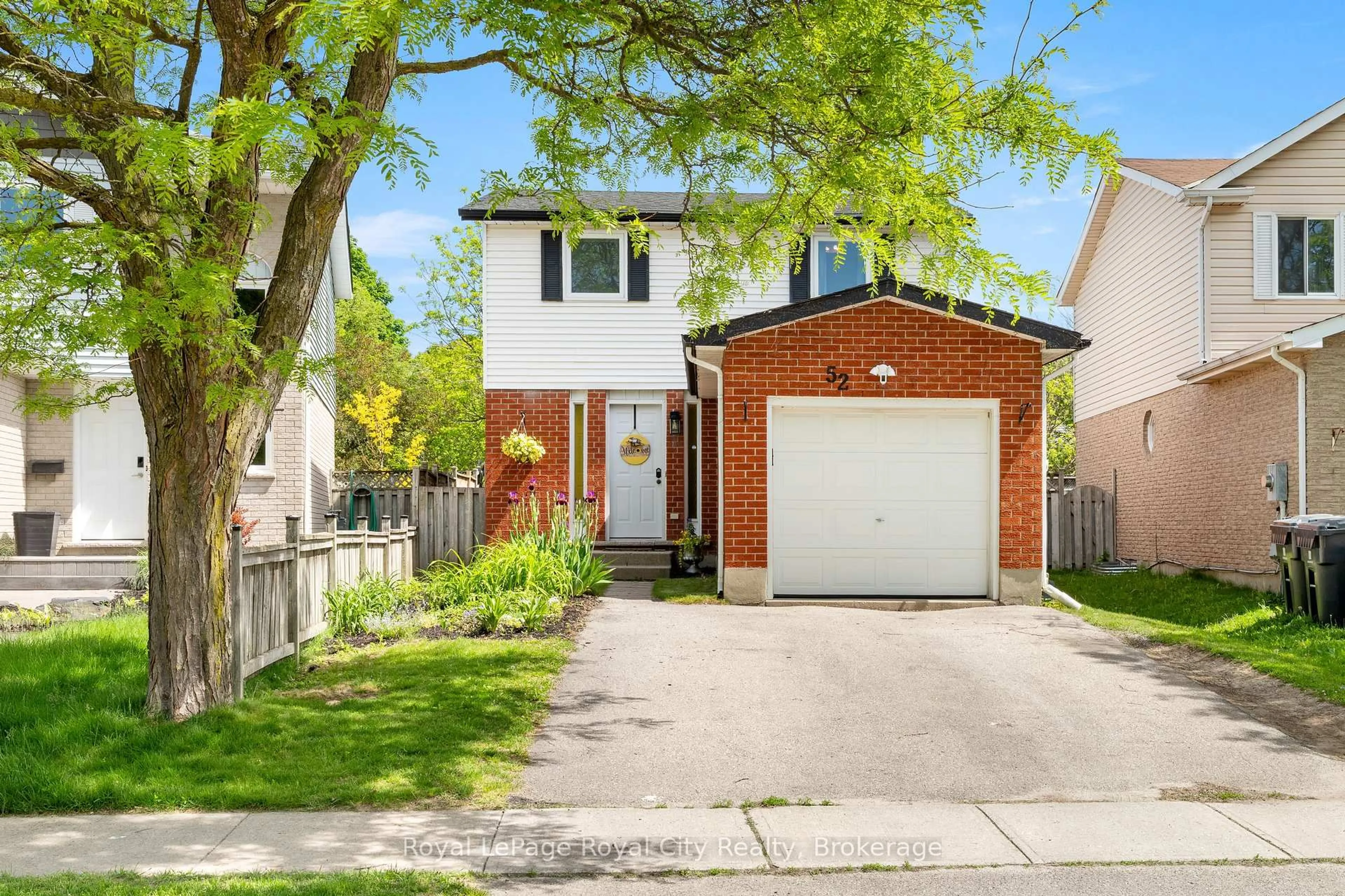 Home with brick exterior material, street for 52 Walman Dr, Guelph Ontario N1G 4G8