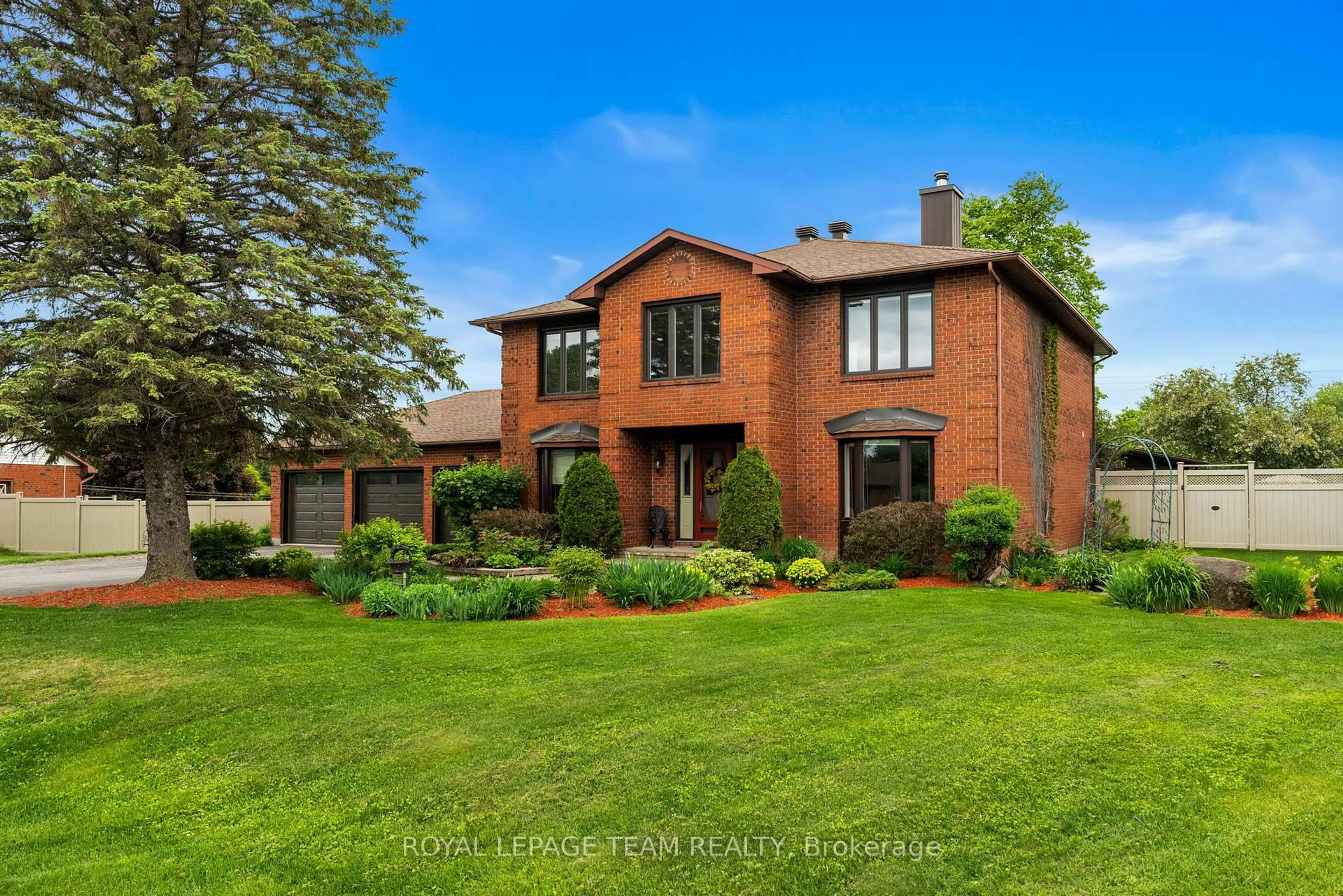 Home with brick exterior material, street for 7009 Quinnfield Way, Ottawa Ontario K4P 1B7