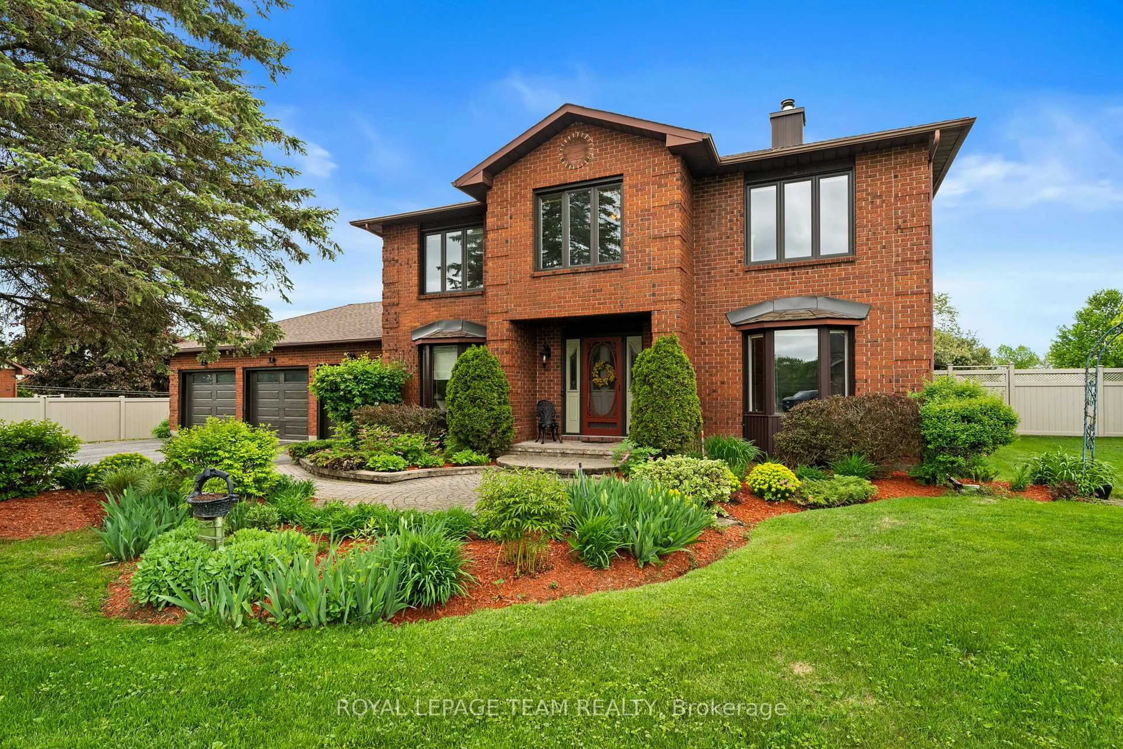 Home with brick exterior material, street for 7009 Quinnfield Way, Ottawa Ontario K4P 1B7