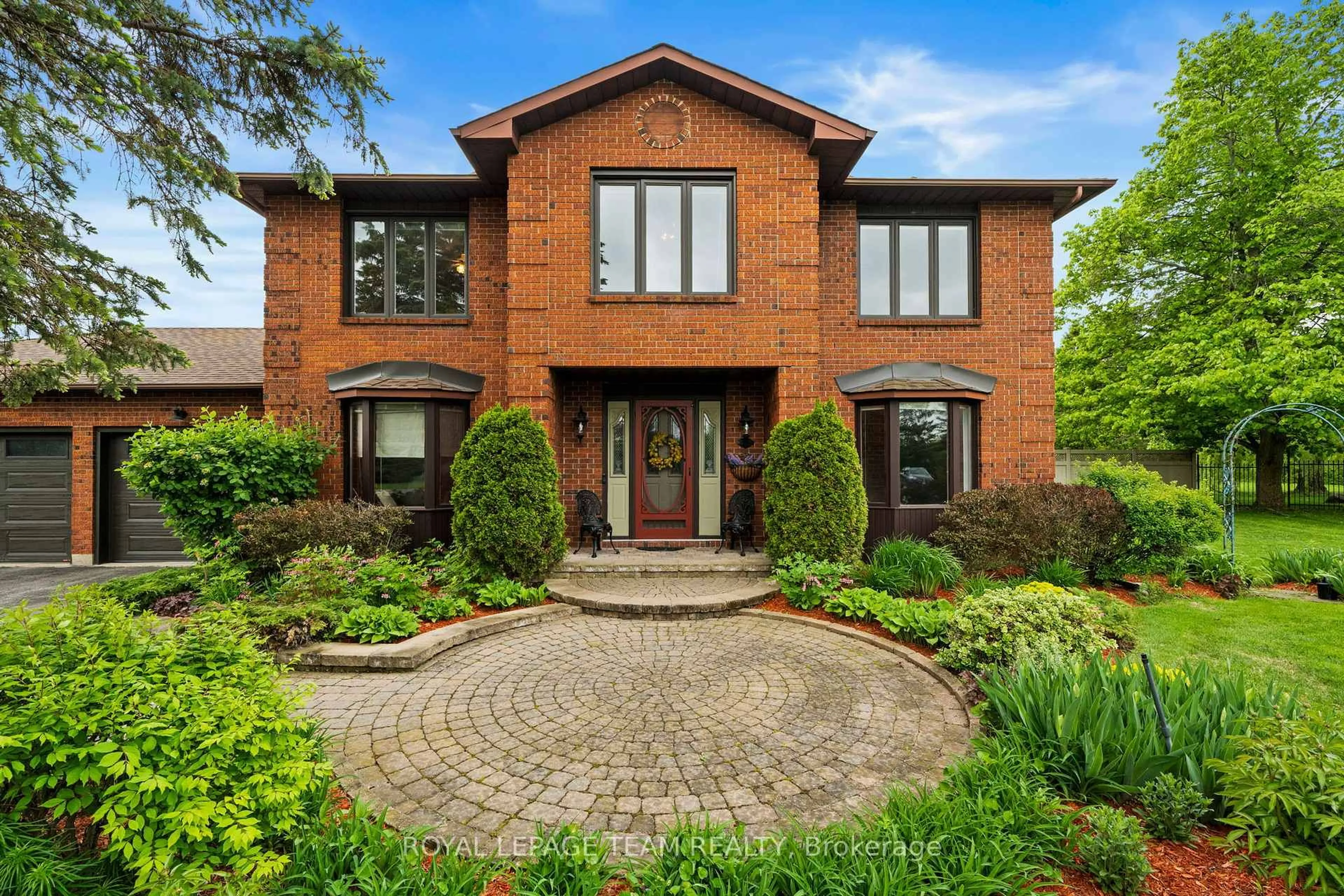 Home with brick exterior material, street for 7009 Quinnfield Way, Ottawa Ontario K4P 1B7