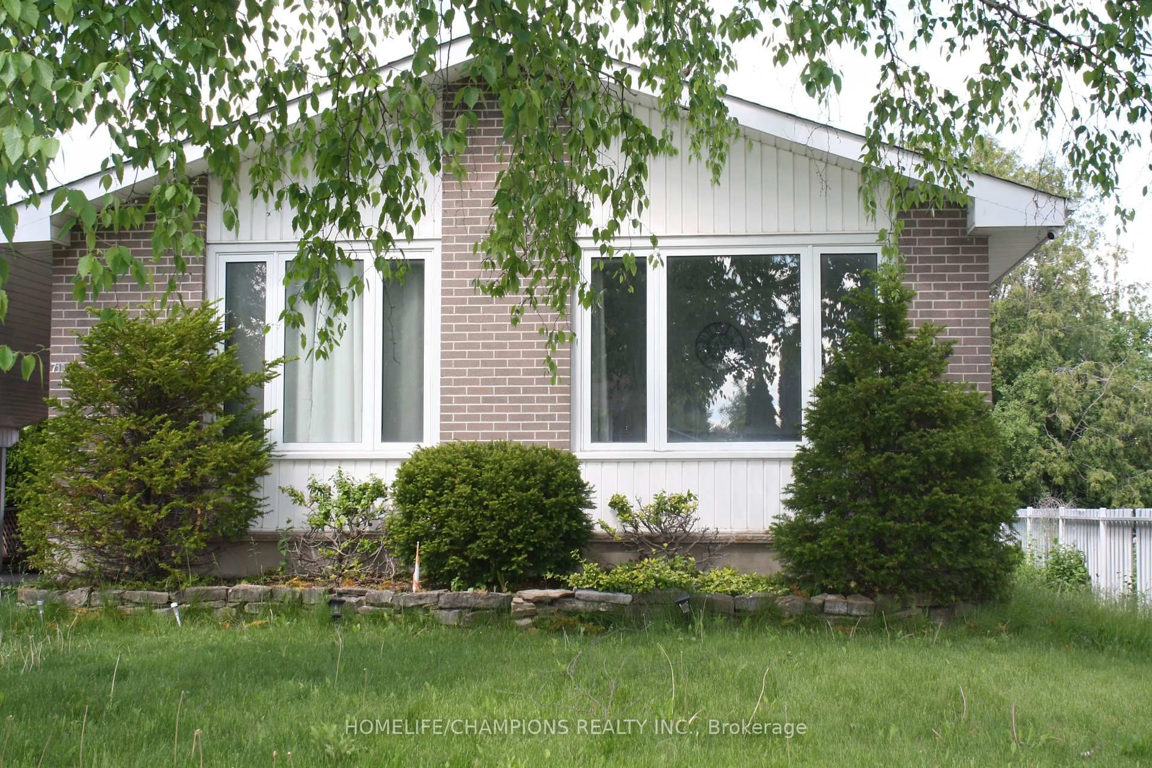 Home with brick exterior material, street for 711 OTONABEE Dr, Peterborough Ontario K9J 7P8