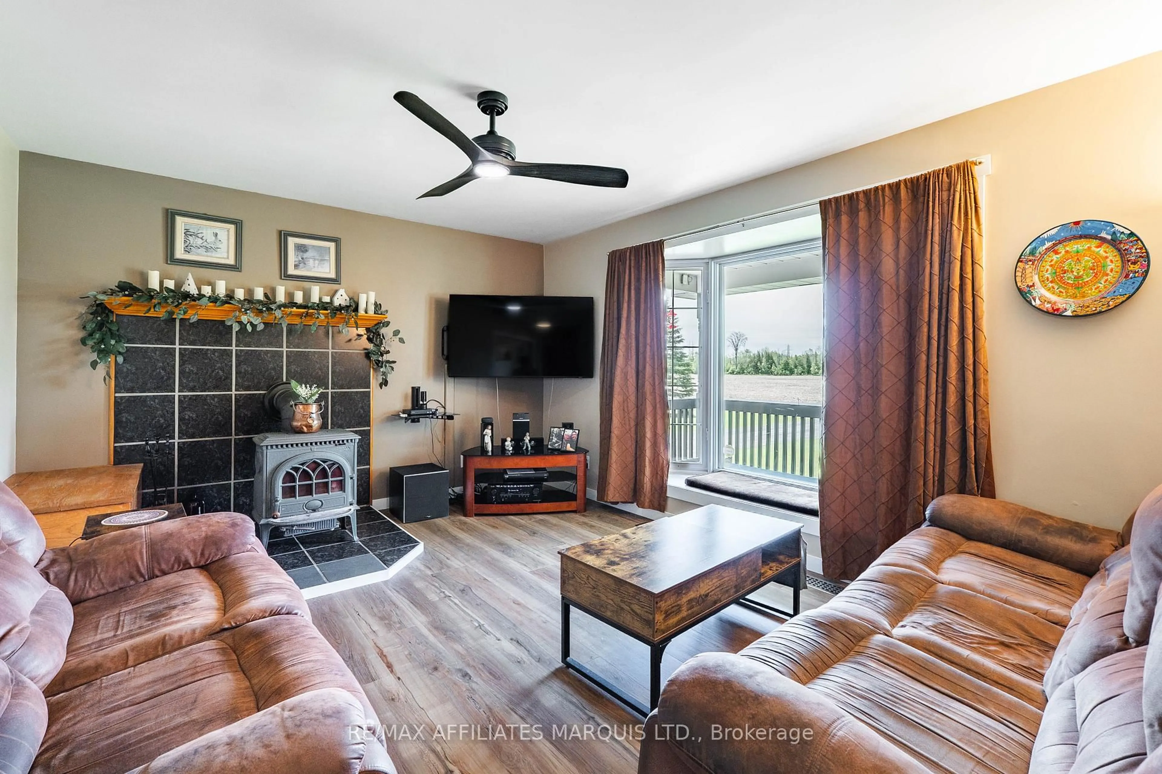 Living room with furniture, wood/laminate floor for 4919 Morgan Rd, South Stormont Ontario K0C 1M0