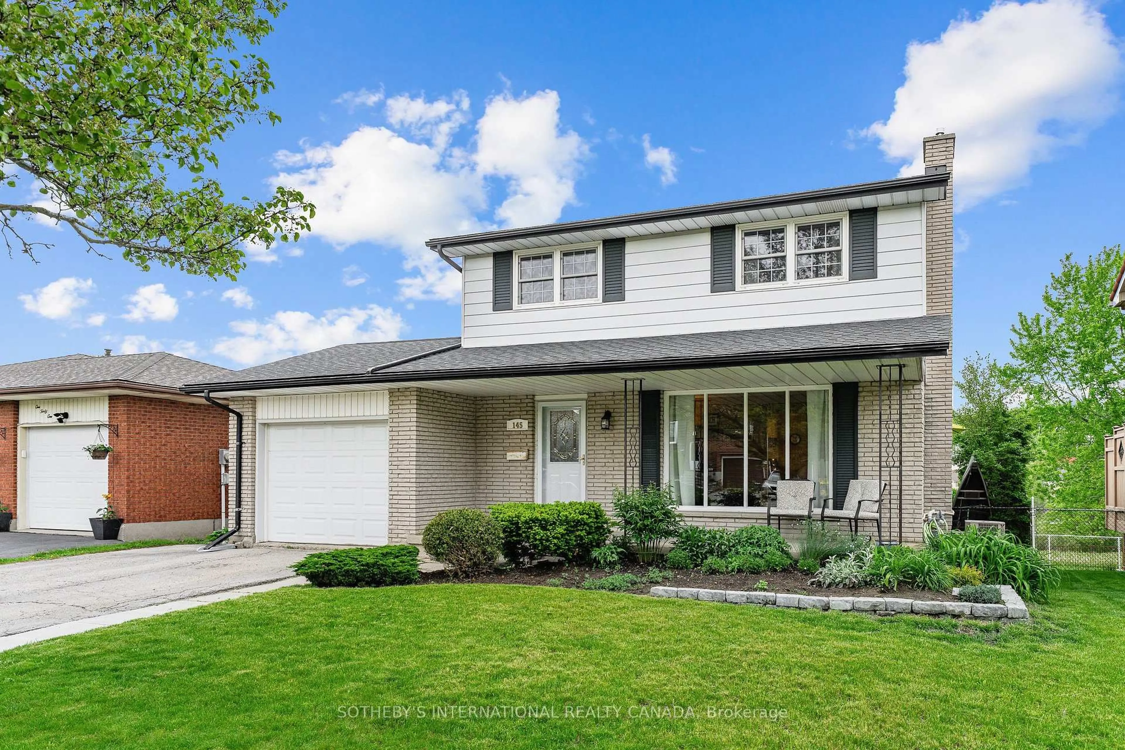 Home with vinyl exterior material, street for 145 Westchester Dr, Kitchener Ontario N2B 3L6
