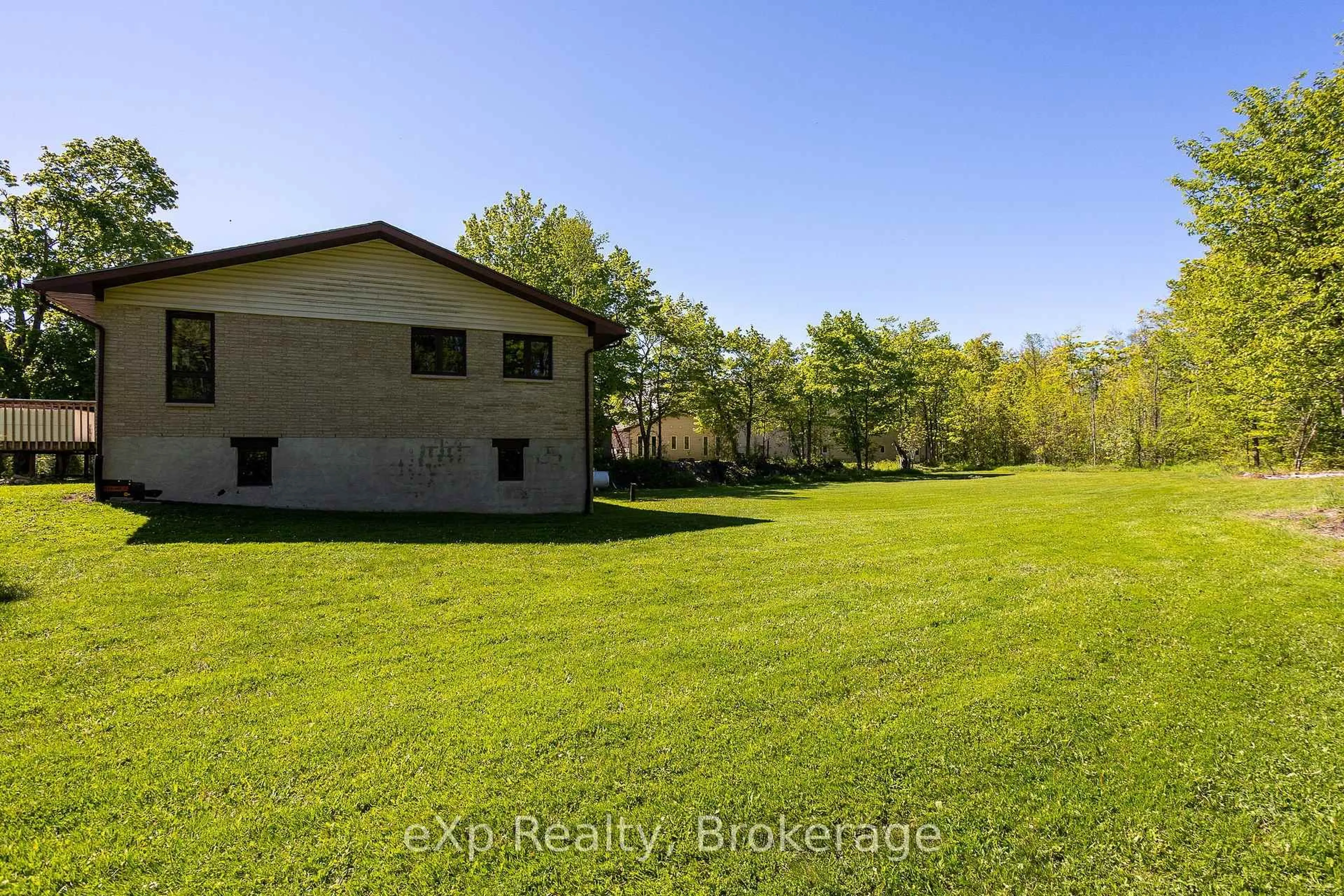 A pic from outside/outdoor area/front of a property/back of a property/a pic from drone, water/lake/river/ocean view for 117 East Rd, Northern Bruce Peninsula Ontario N0H 1W0
