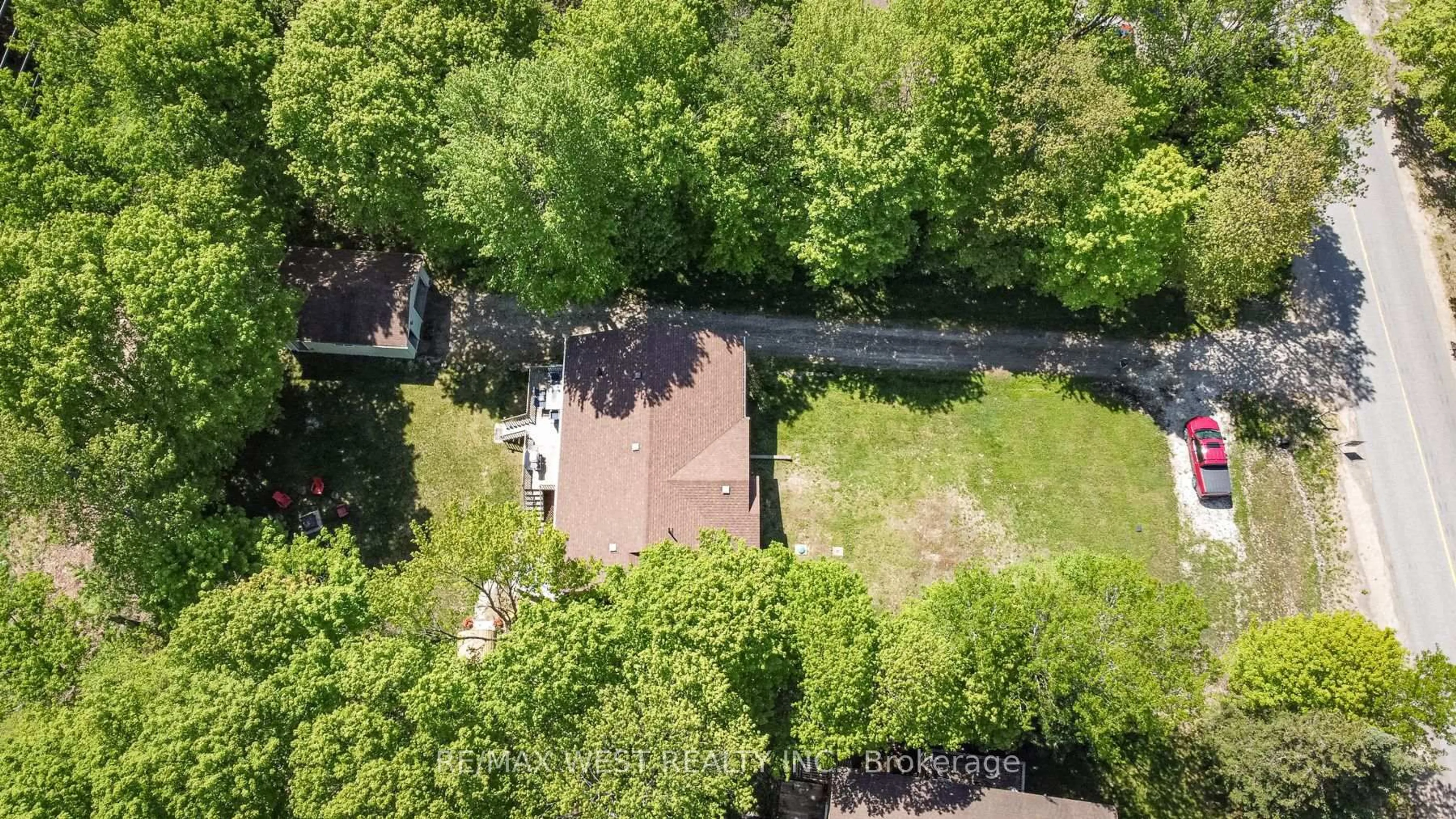 A pic from outside/outdoor area/front of a property/back of a property/a pic from drone, forest/trees view for 1084 Bonnie Lake Rd, Bracebridge Ontario P1L 1W9