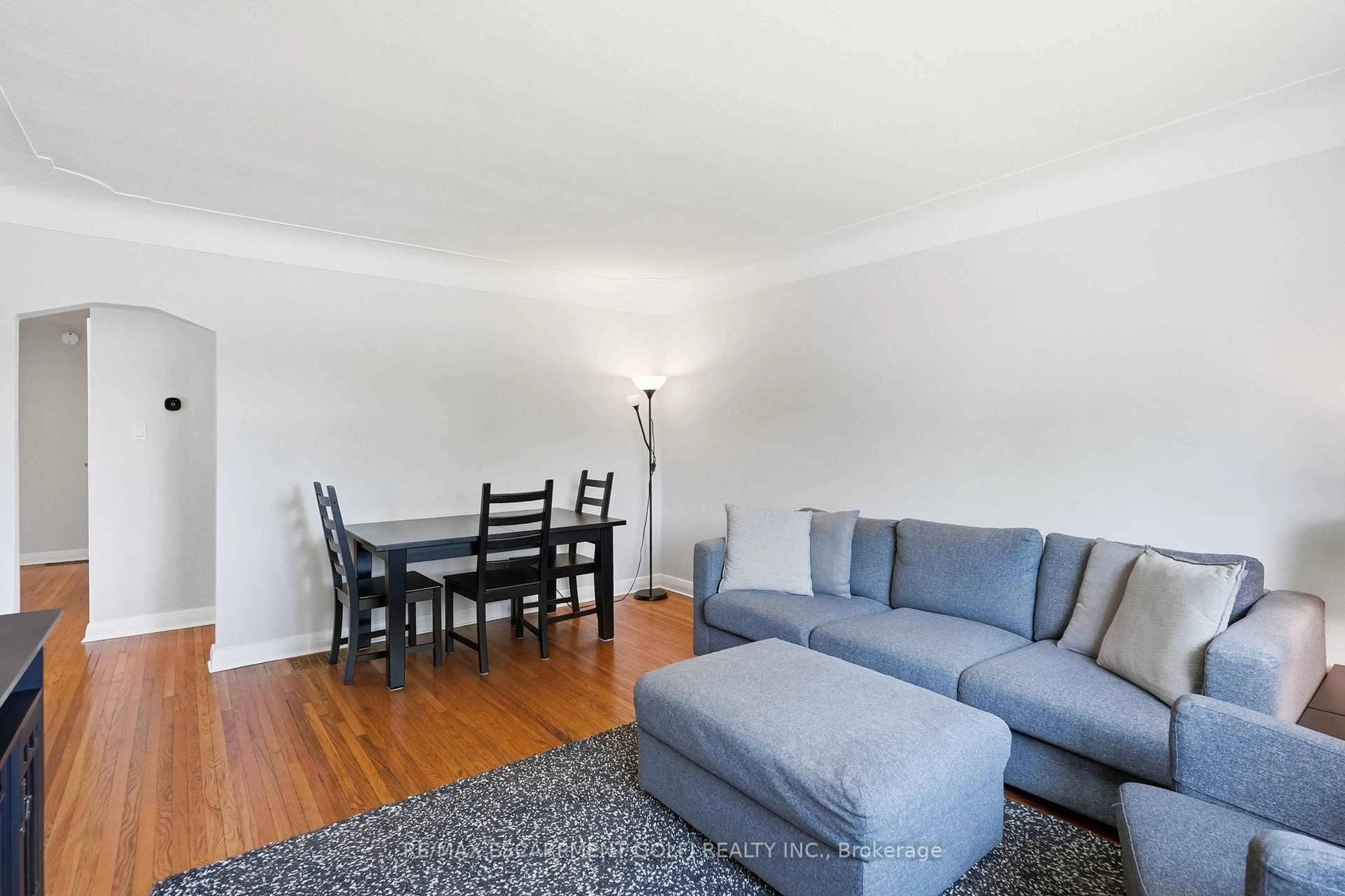 Living room with furniture, wood/laminate floor for 764 Brucedale Ave, Hamilton Ontario L8V 1R9