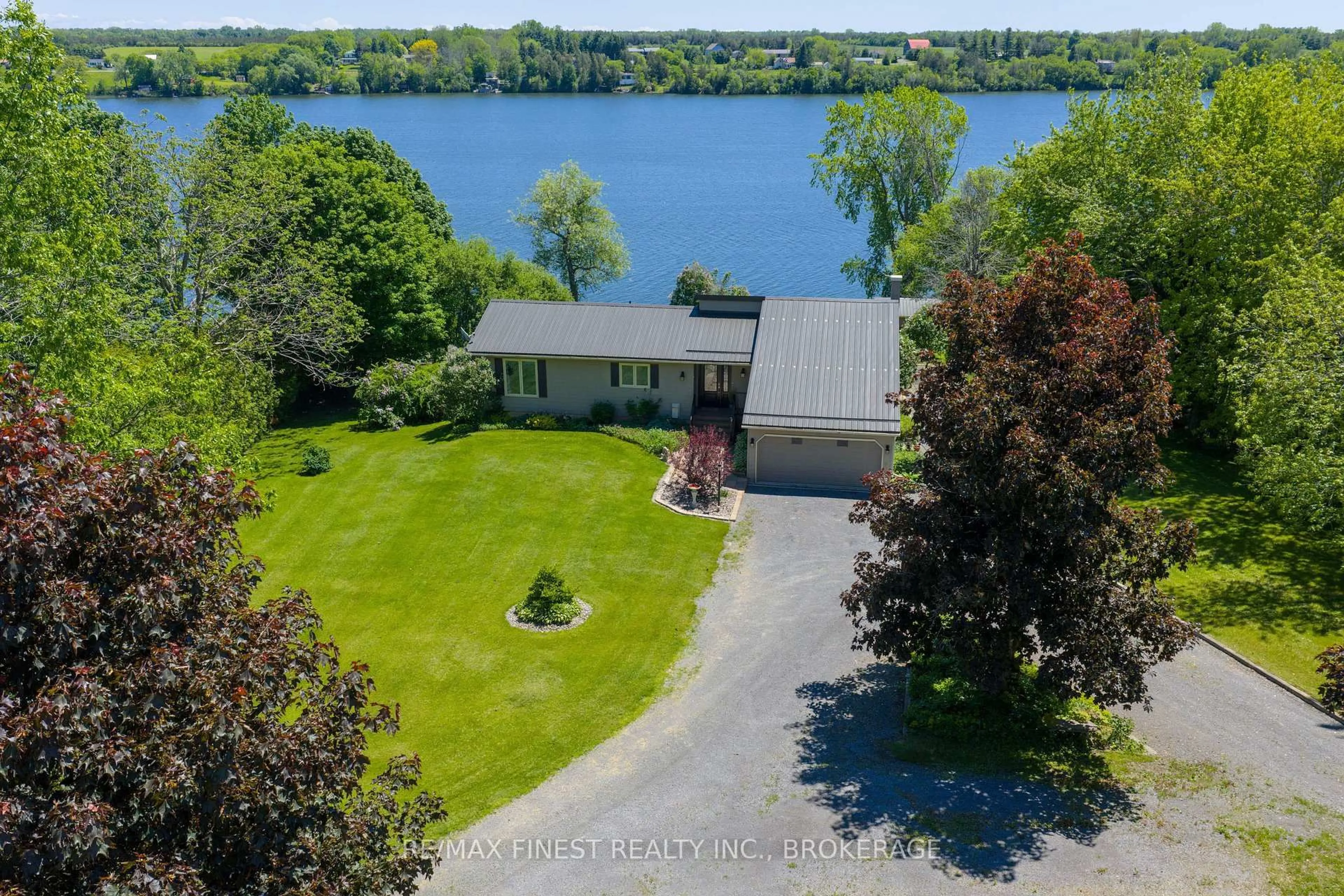 A pic from outside/outdoor area/front of a property/back of a property/a pic from drone, water/lake/river/ocean view for 5103 County Road 9, Napanee Ontario K7R 3K8
