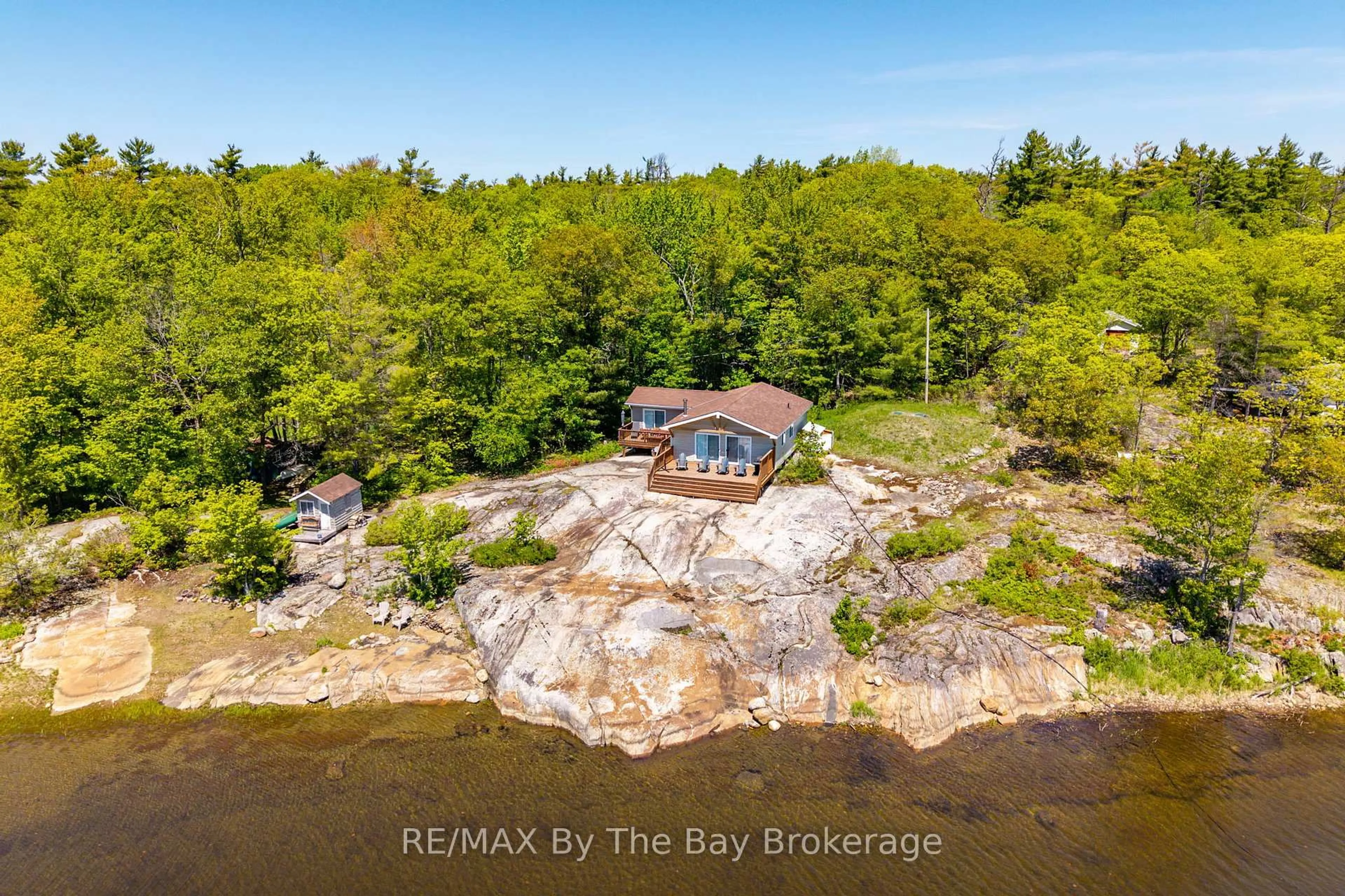 A pic from outside/outdoor area/front of a property/back of a property/a pic from drone, water/lake/river/ocean view for 6980 Island 1810/Bone Island, Georgian Bay Ontario L0K 1E0