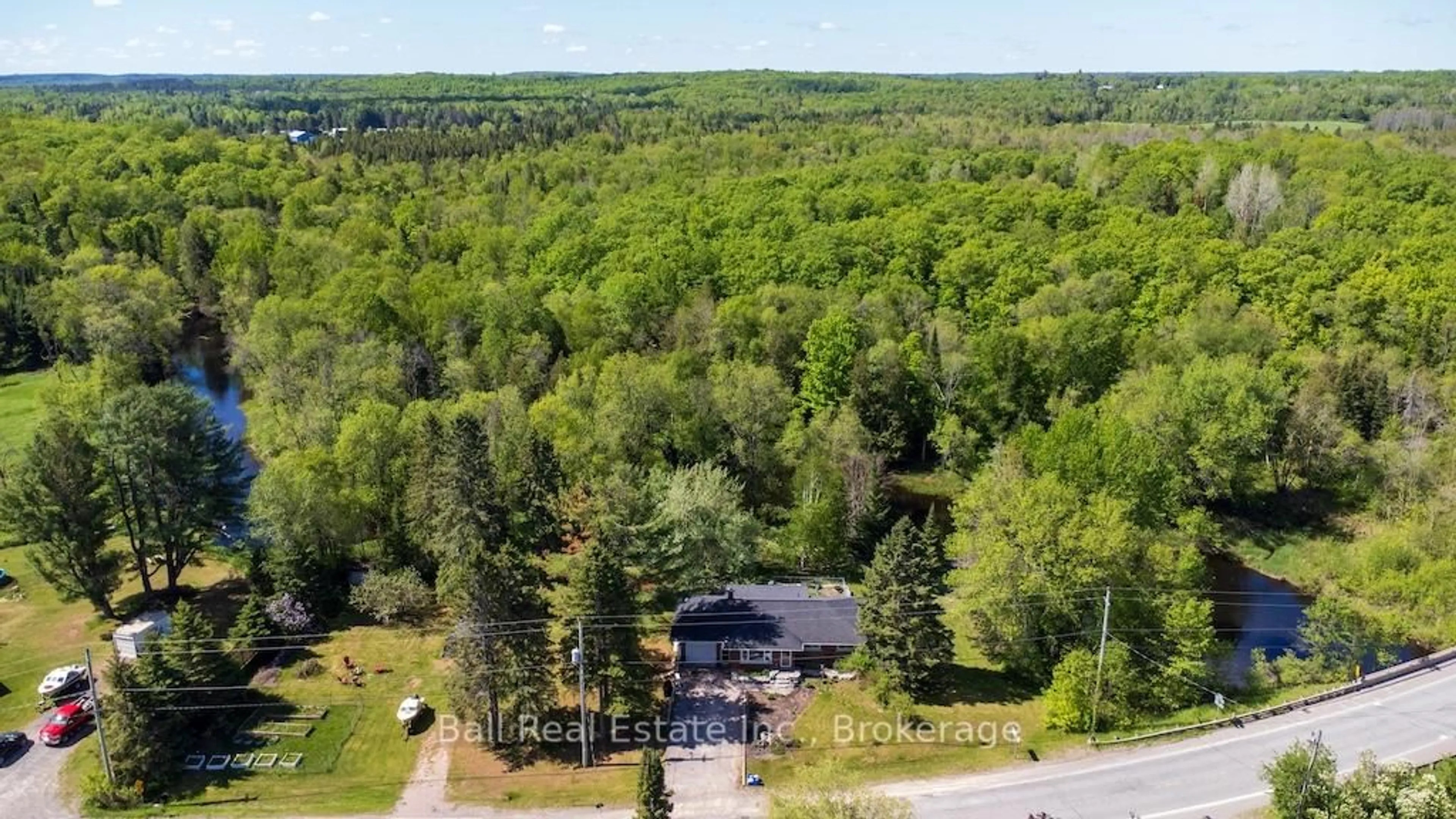 A pic from outside/outdoor area/front of a property/back of a property/a pic from drone, forest/trees view for 3993 County Rd 620, North Kawartha Ontario K0L 1A0