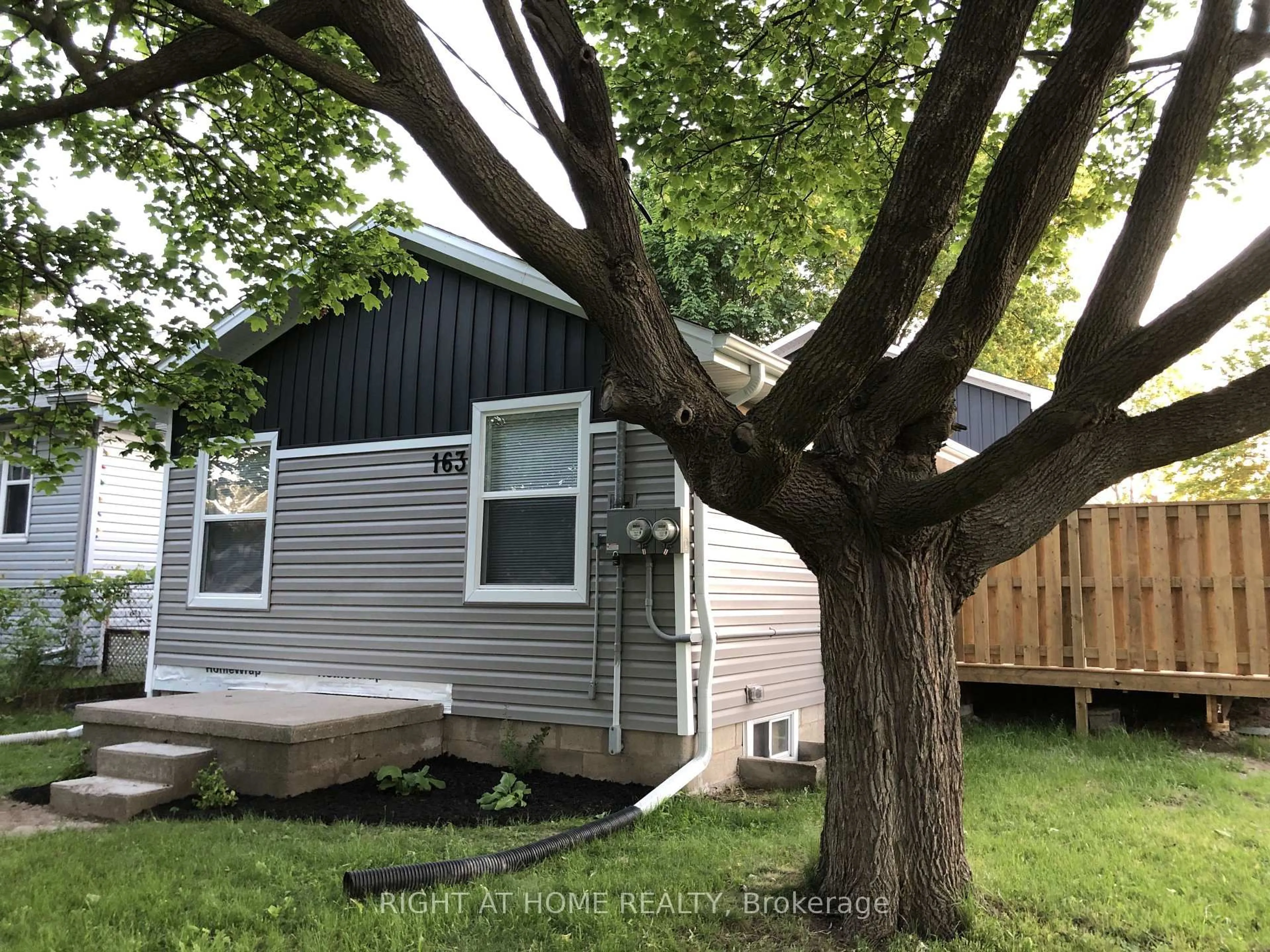 Home with vinyl exterior material, street for 163 Emerson St, London South Ontario N5Z 3L5