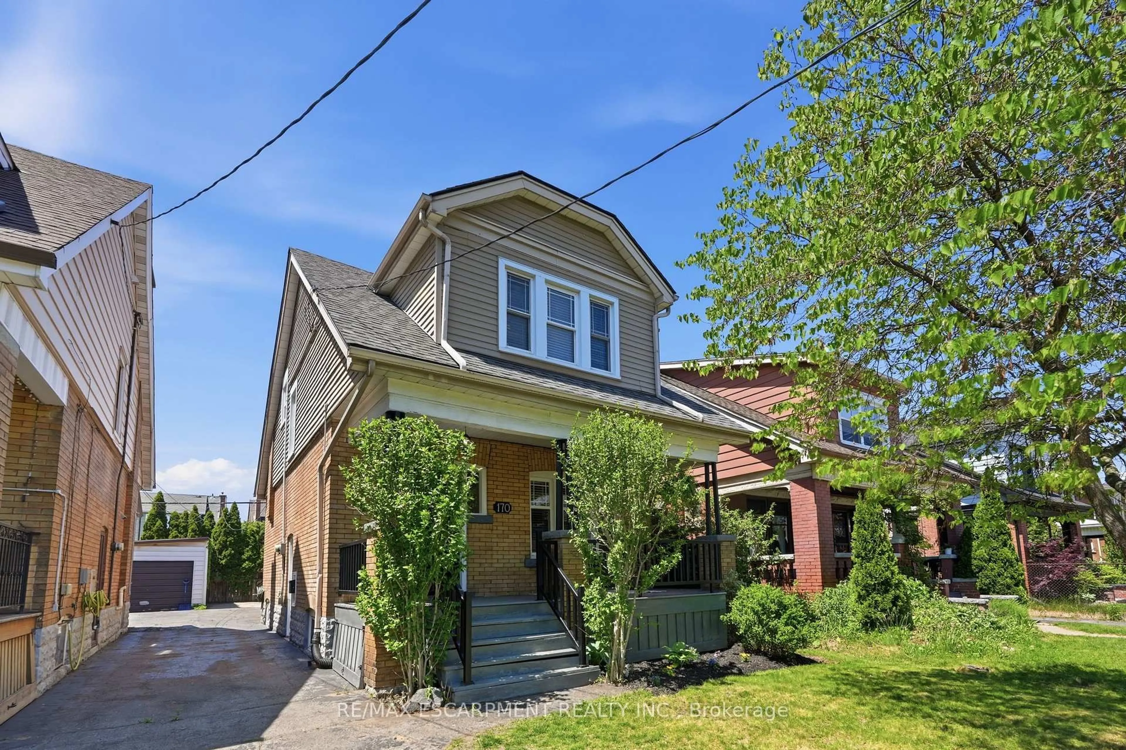 Home with brick exterior material, street for 170 Kensington Ave, Hamilton Ontario L8M 3H5