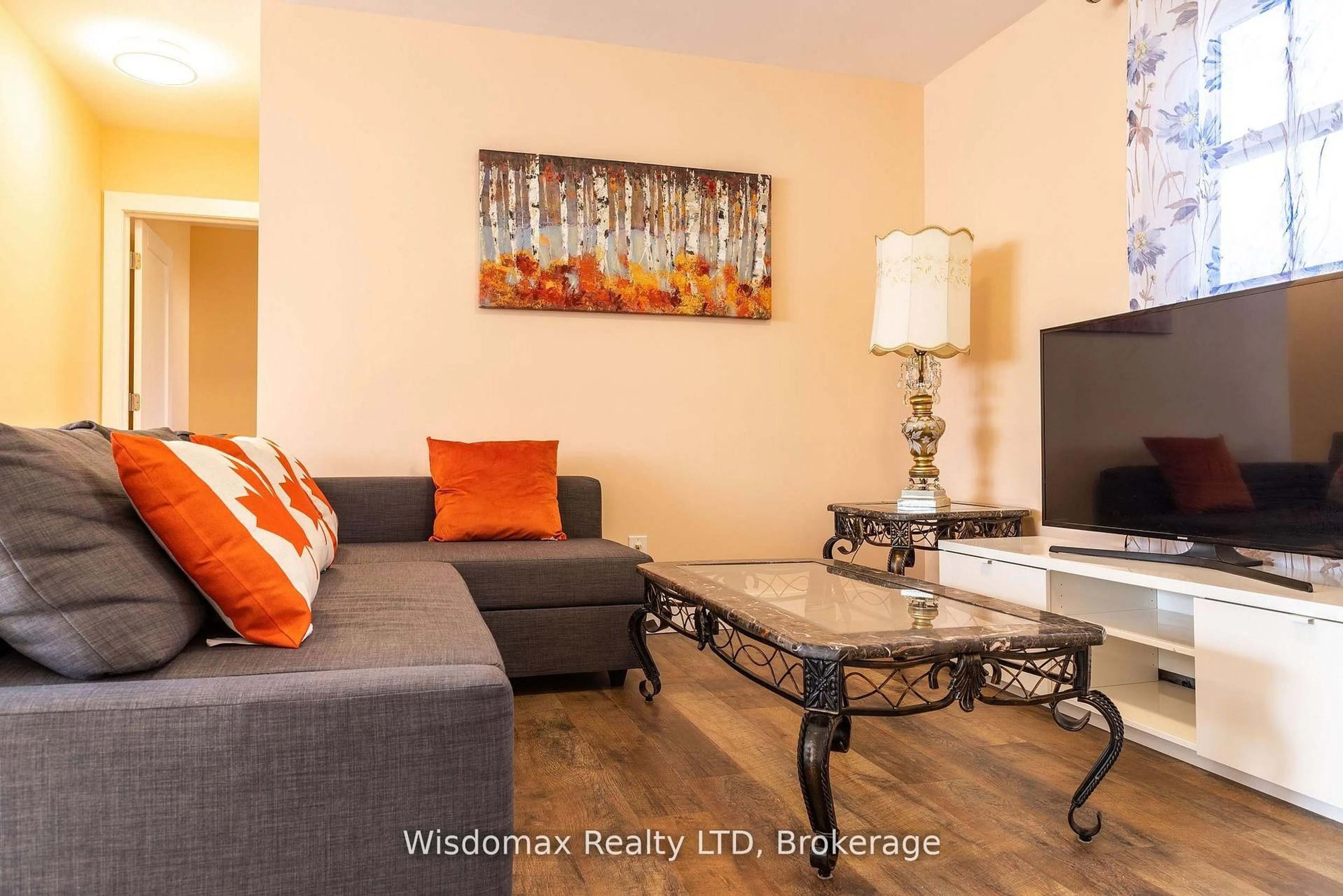 Living room with furniture, wood/laminate floor for 5291 STAMFORD St, Niagara Falls Ontario L2E 1N2