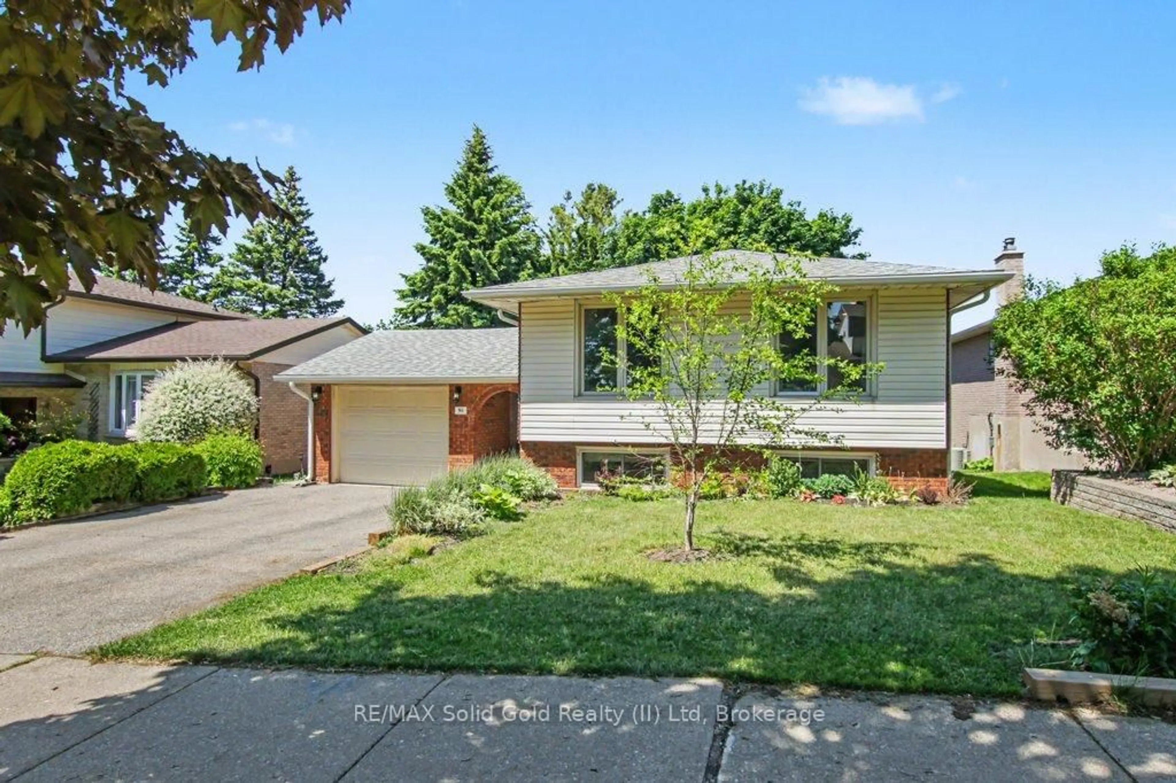 Home with vinyl exterior material, street for 94 Devonglen Dr, Kitchener Ontario N2E 2C5