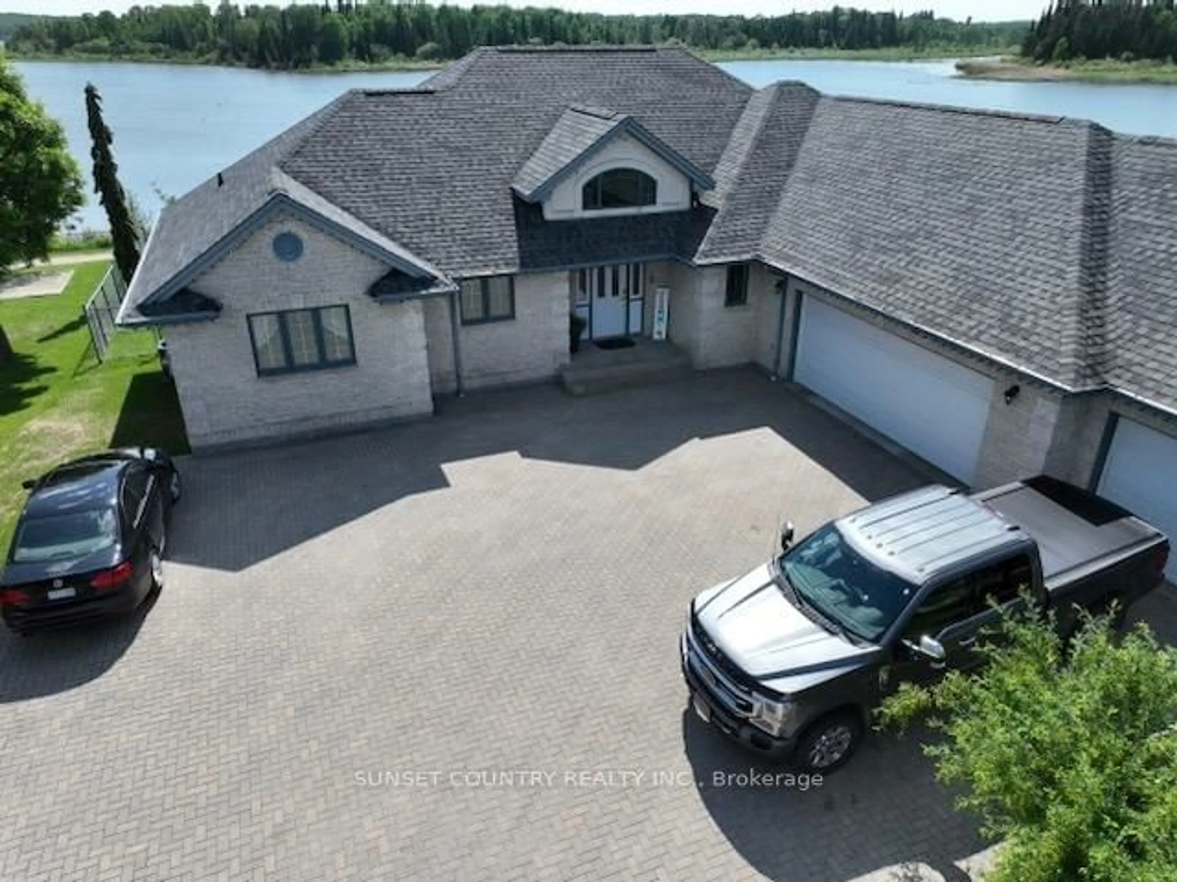 A pic from outside/outdoor area/front of a property/back of a property/a pic from drone, water/lake/river/ocean view for 92 Edgewater Dr, Dryden Ontario P8N 3K2