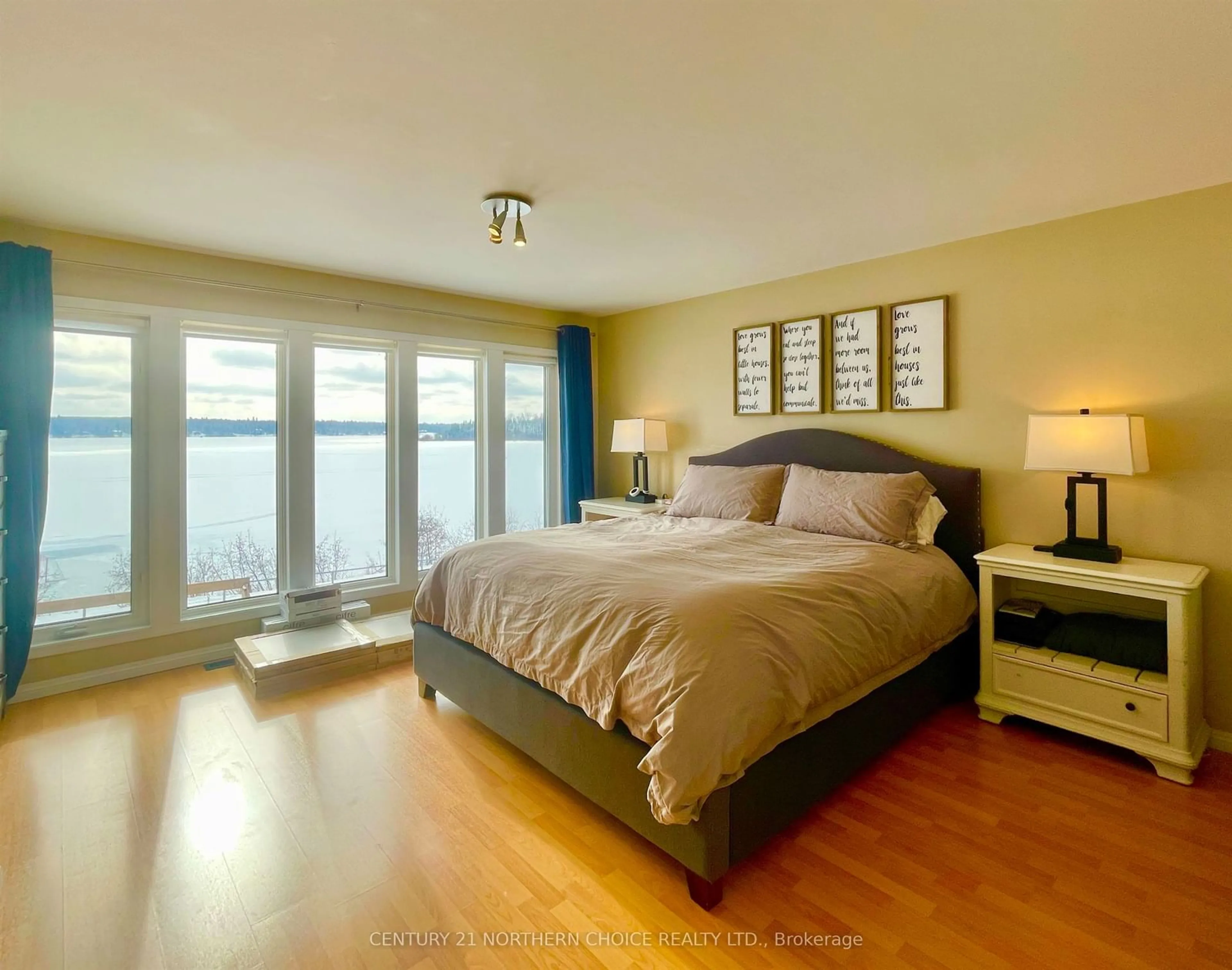 Bedroom with bed, wood/laminate floor for 100 Edgewater Dr, Dryden Ontario P8N 3K2