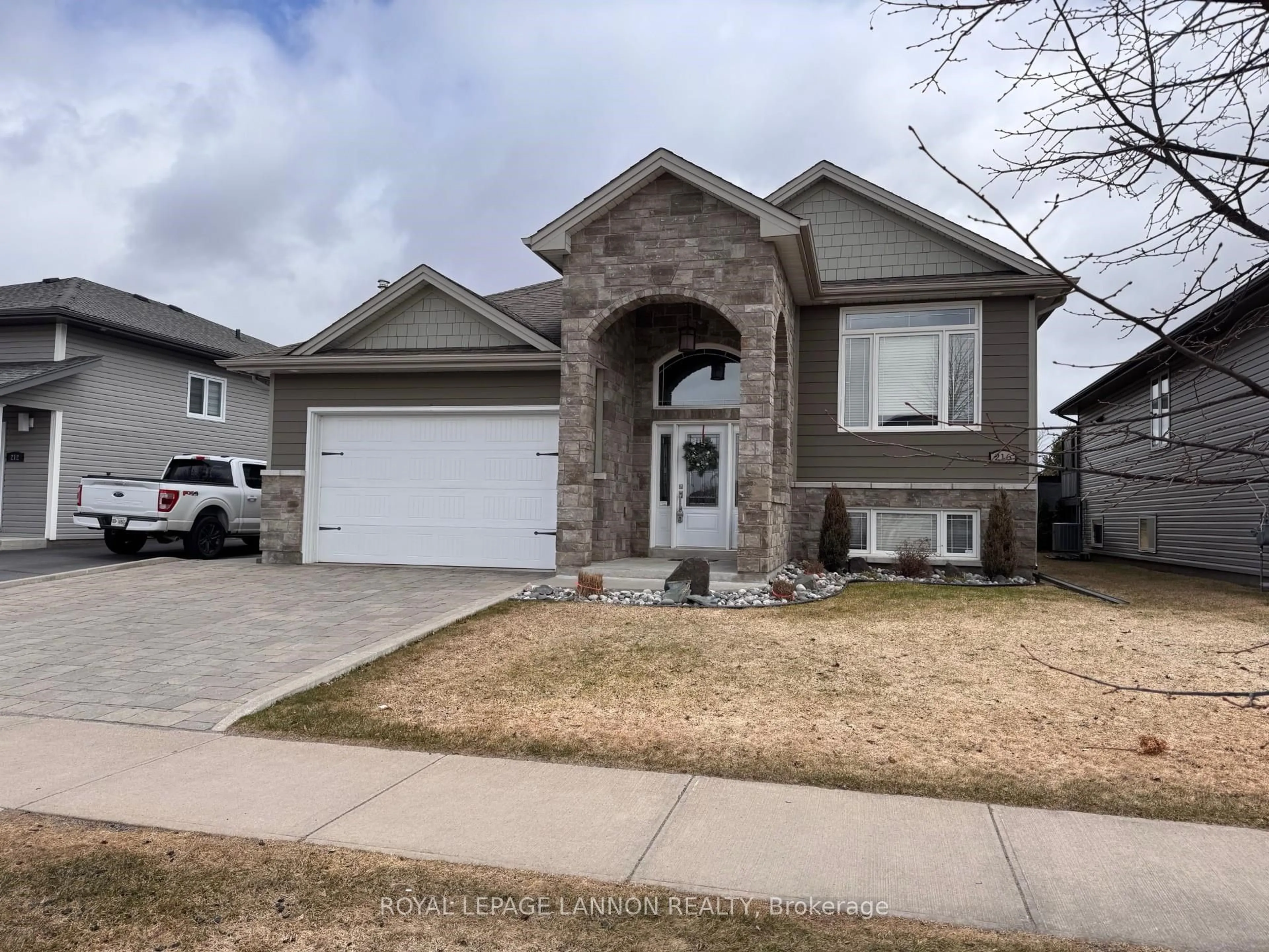 Home with vinyl exterior material, street for 216 Cougar Cres, Thunder Bay Ontario P7C 0B2