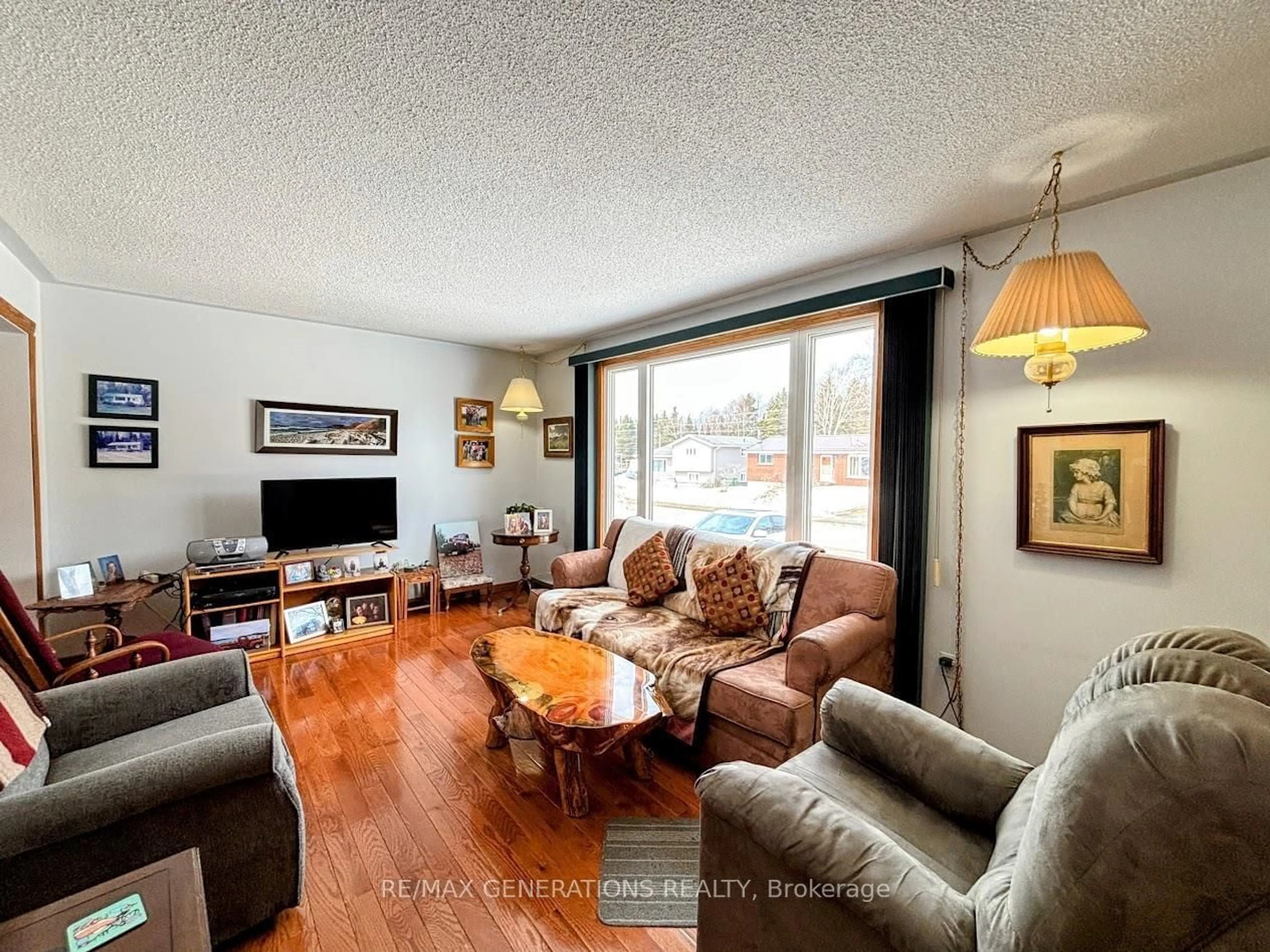 Living room with furniture, wood/laminate floor for 14 Lloyd Irwin St, Marathon Ontario P0T 2E0