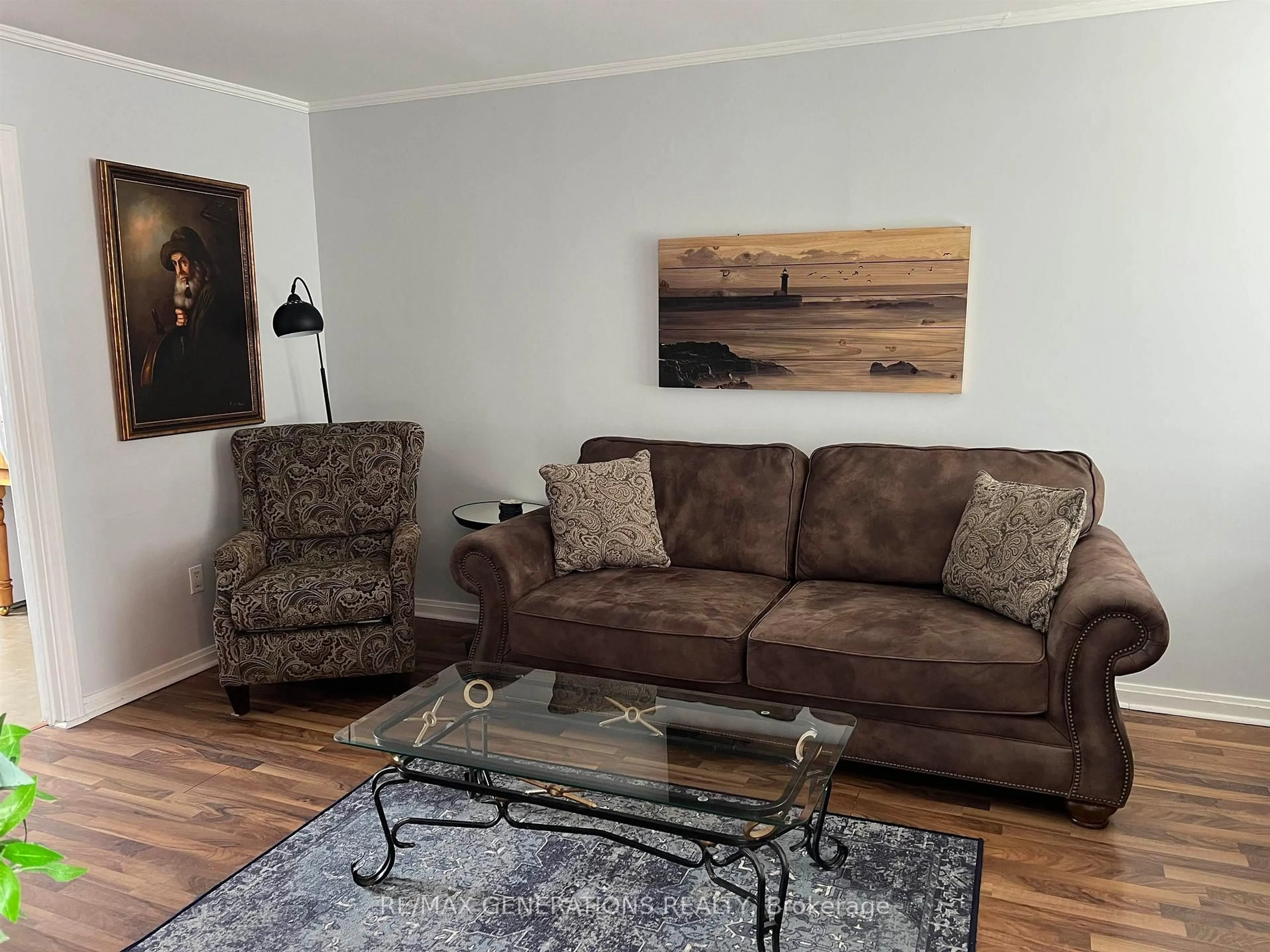 Living room with furniture, wood/laminate floor for 32 McCullough St, Marathon Ontario P0T 2E0
