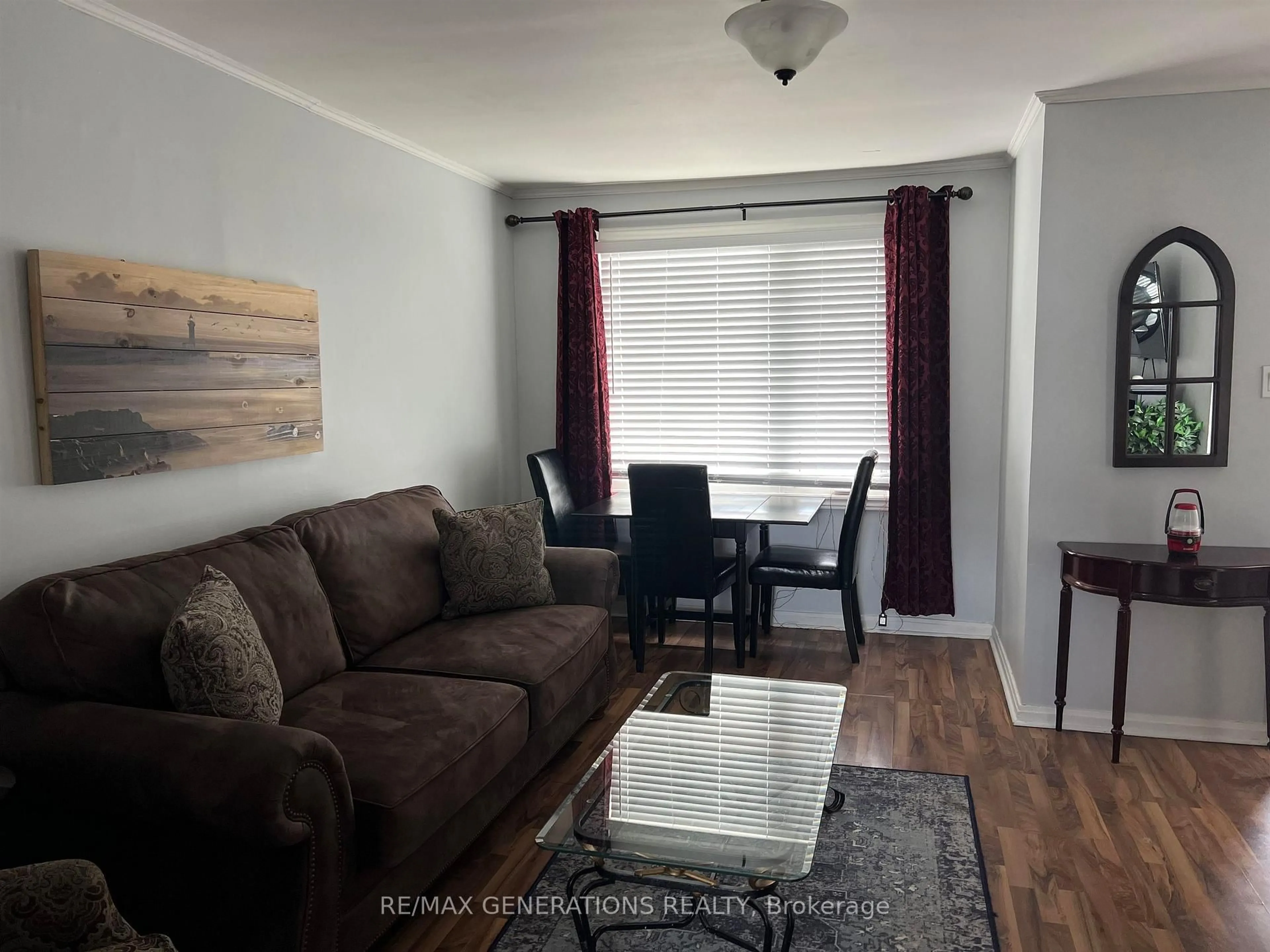 Living room with furniture, wood/laminate floor for 32 McCullough St, Marathon Ontario P0T 2E0