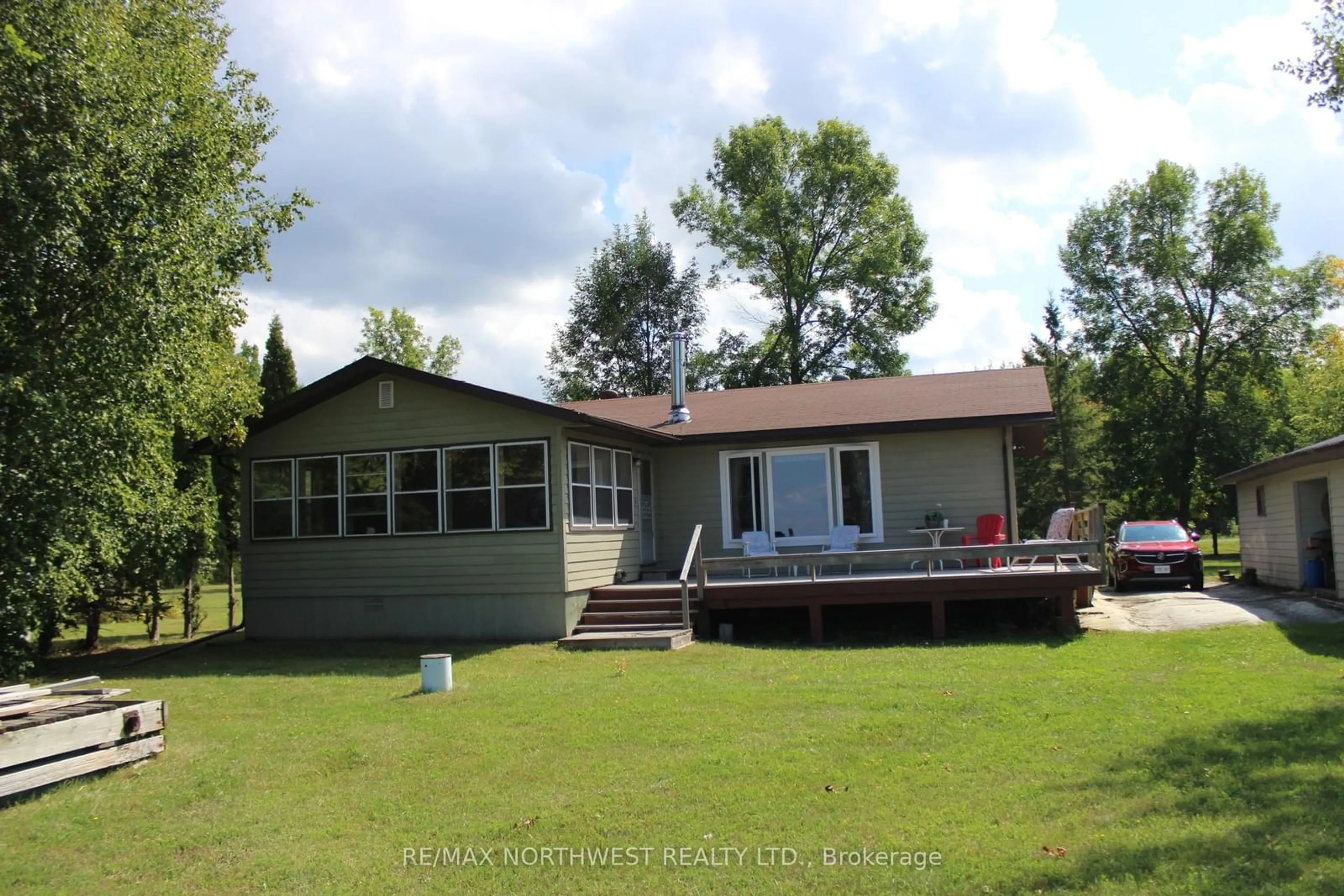A pic from outside/outdoor area/front of a property/back of a property/a pic from drone, water/lake/river/ocean view for 93 STINTZI DR E, Lake of the Woods Ontario P0W 1J0