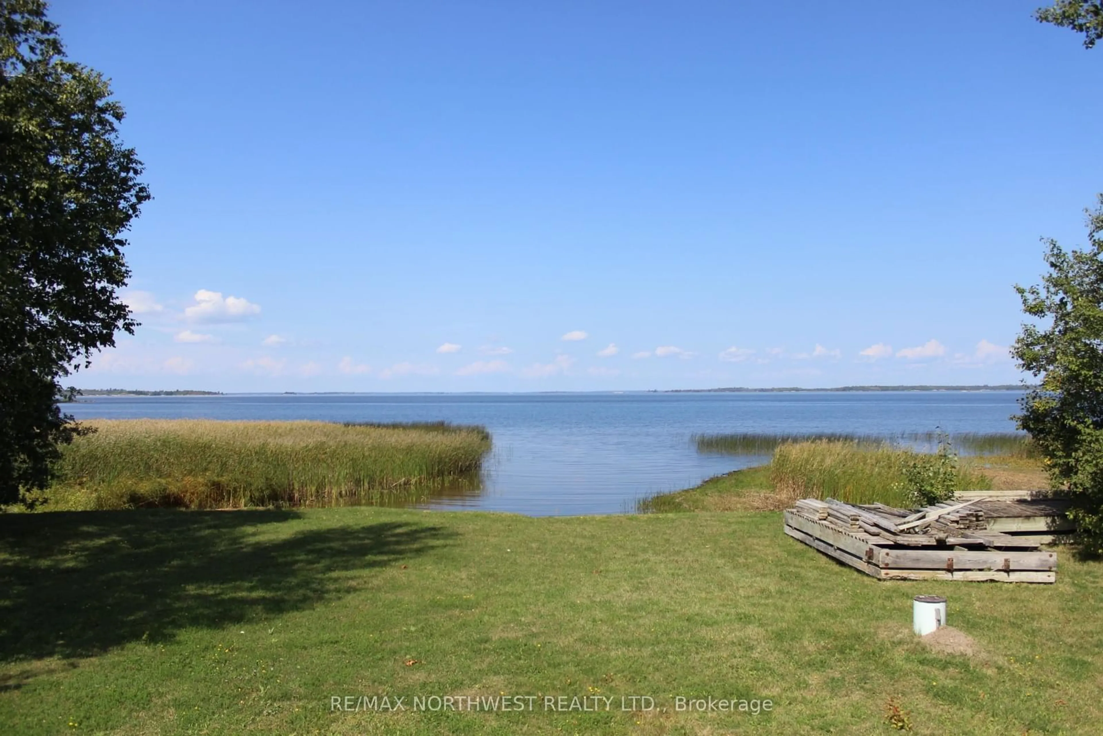 A pic from outside/outdoor area/front of a property/back of a property/a pic from drone, water/lake/river/ocean view for 93 STINTZI DR E, Lake of the Woods Ontario P0W 1J0