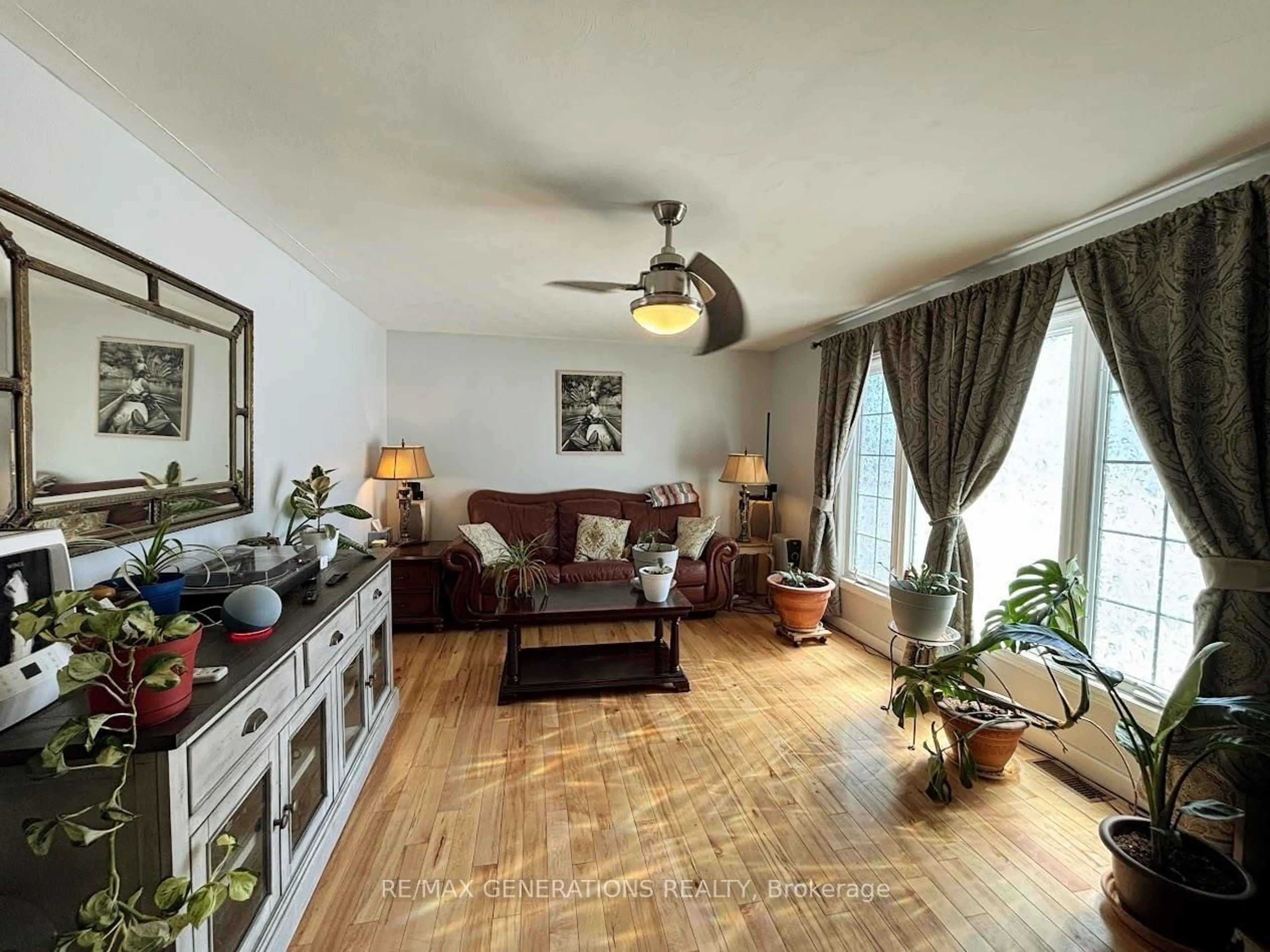 Living room with furniture, wood/laminate floor for 7 Swallow Dr, Manitouwadge Ontario P0T 2C0