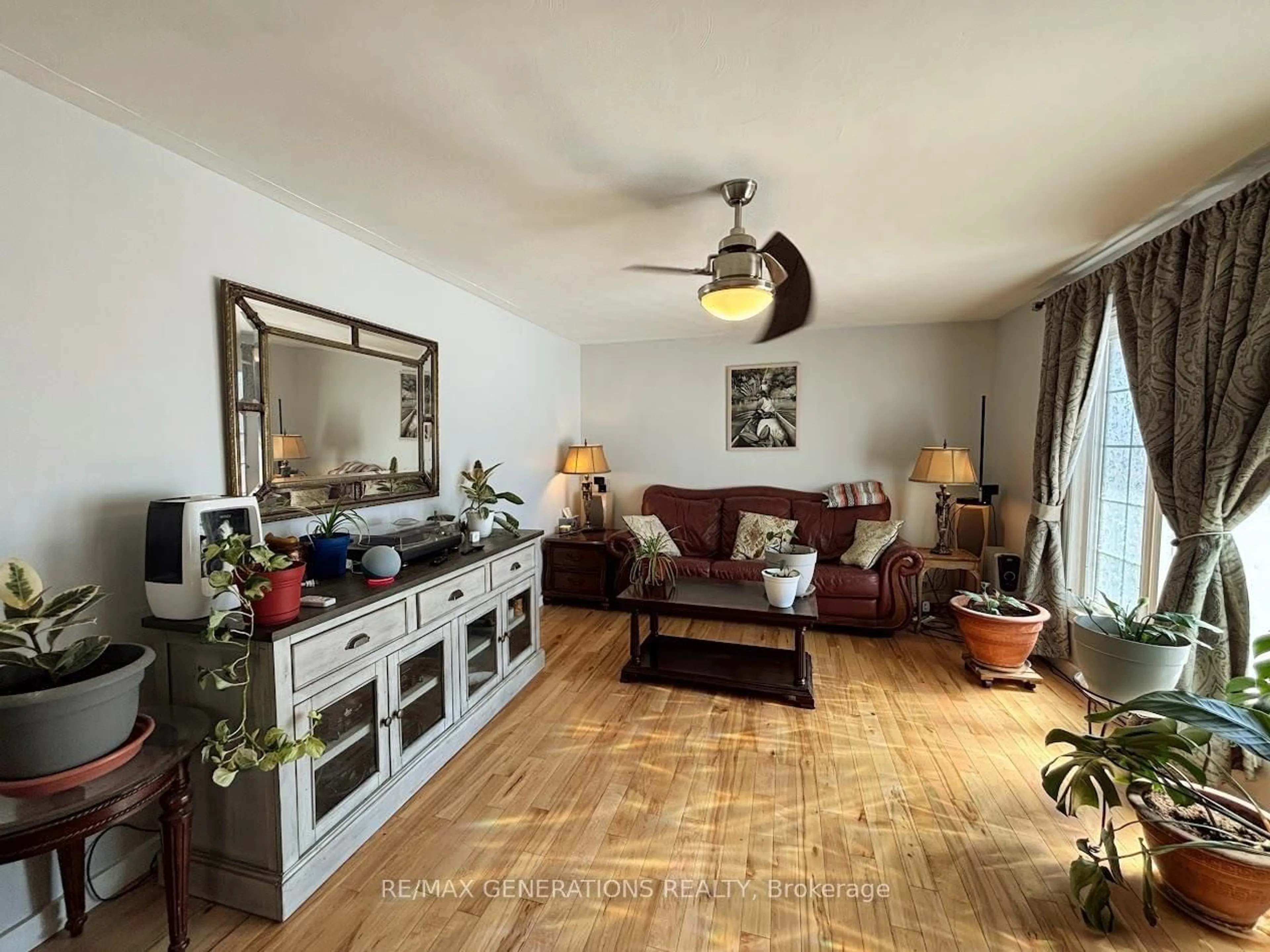 Living room with furniture, wood/laminate floor for 7 Swallow Dr, Manitouwadge Ontario P0T 2C0
