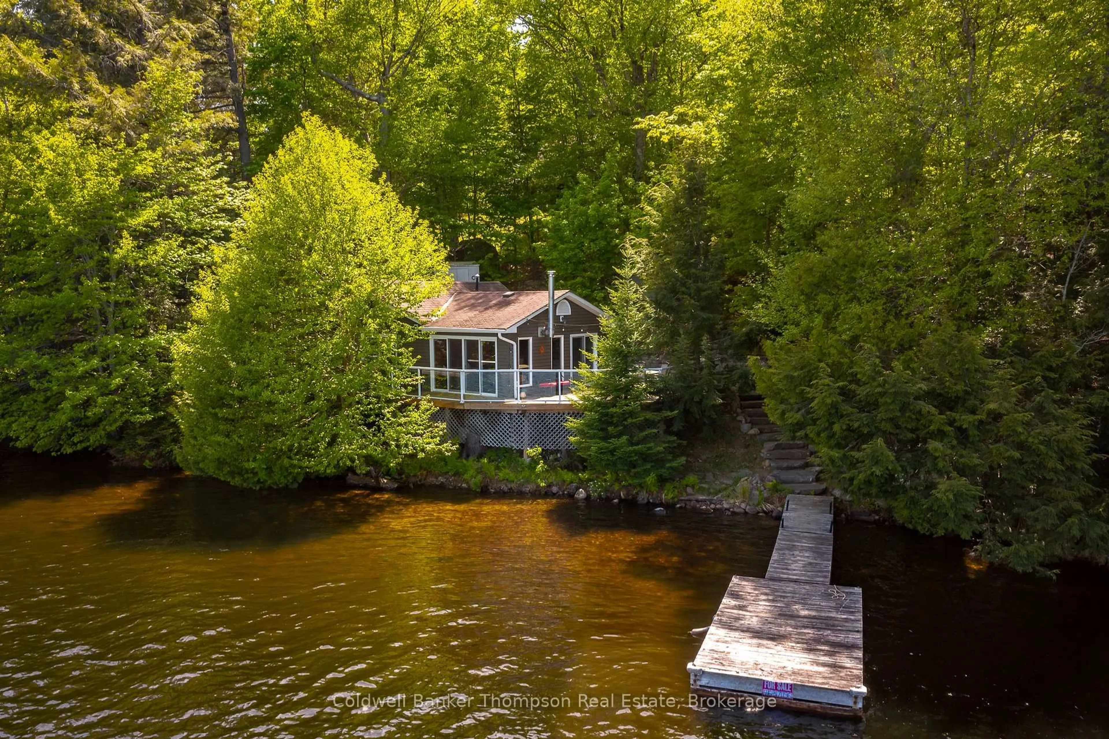 A pic from outside/outdoor area/front of a property/back of a property/a pic from drone, water/lake/river/ocean view for 61 Maple Dr, Perry Ontario P0A 1J0