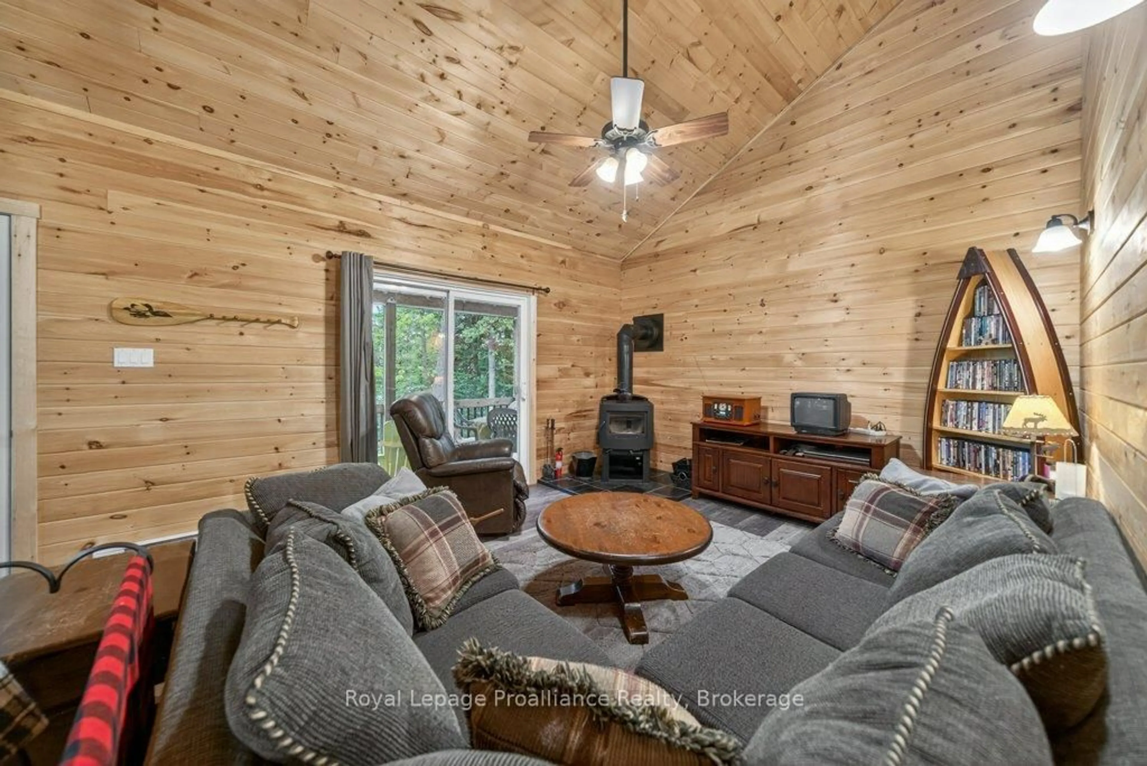 Living room with furniture, wood/laminate floor for 1051B Hereford Highland Lane, Ardoch Ontario K0H 1C0