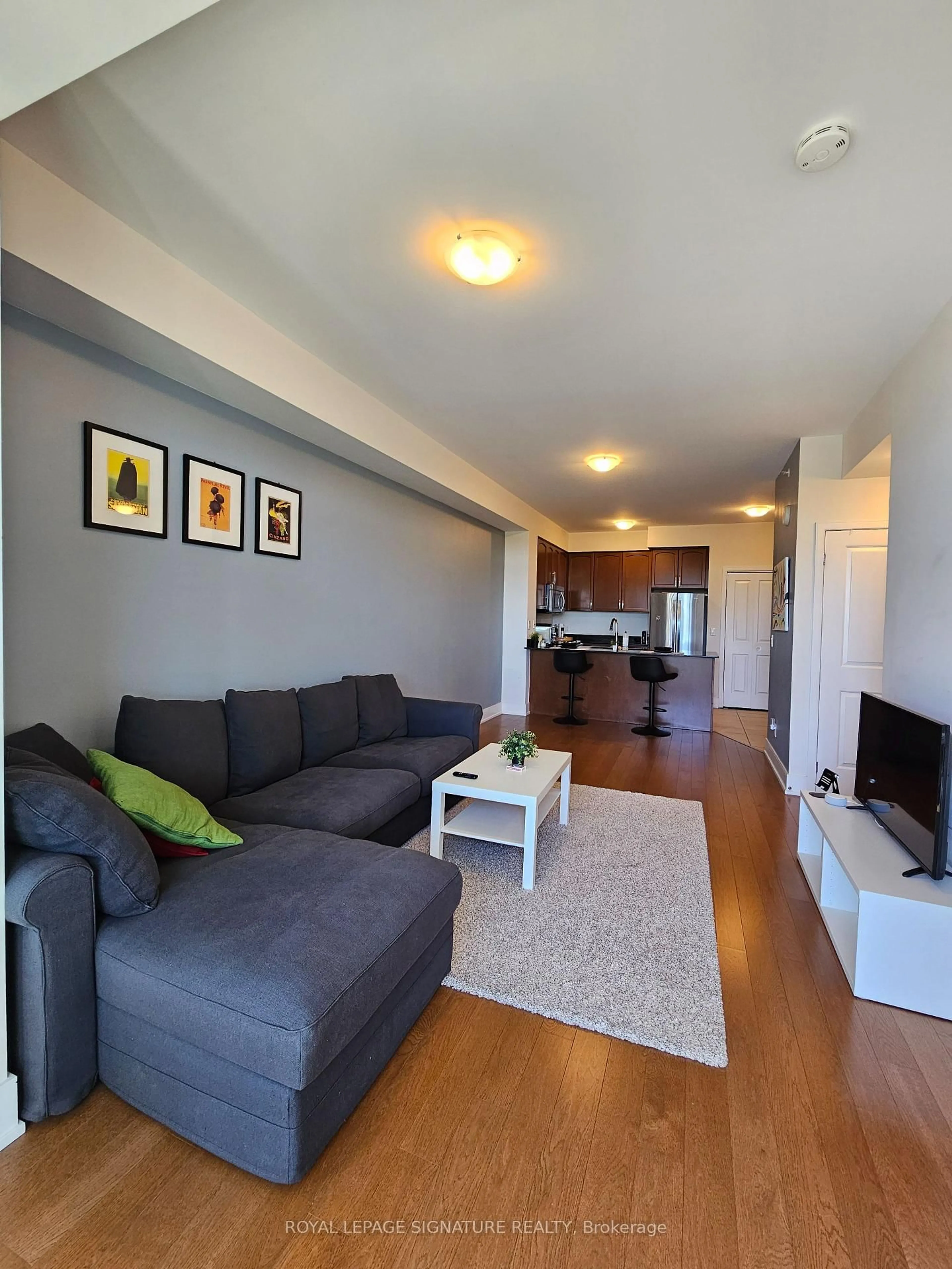 Living room with furniture, wood/laminate floor for 144 Park St #506, Waterloo Ontario N2L 0B6