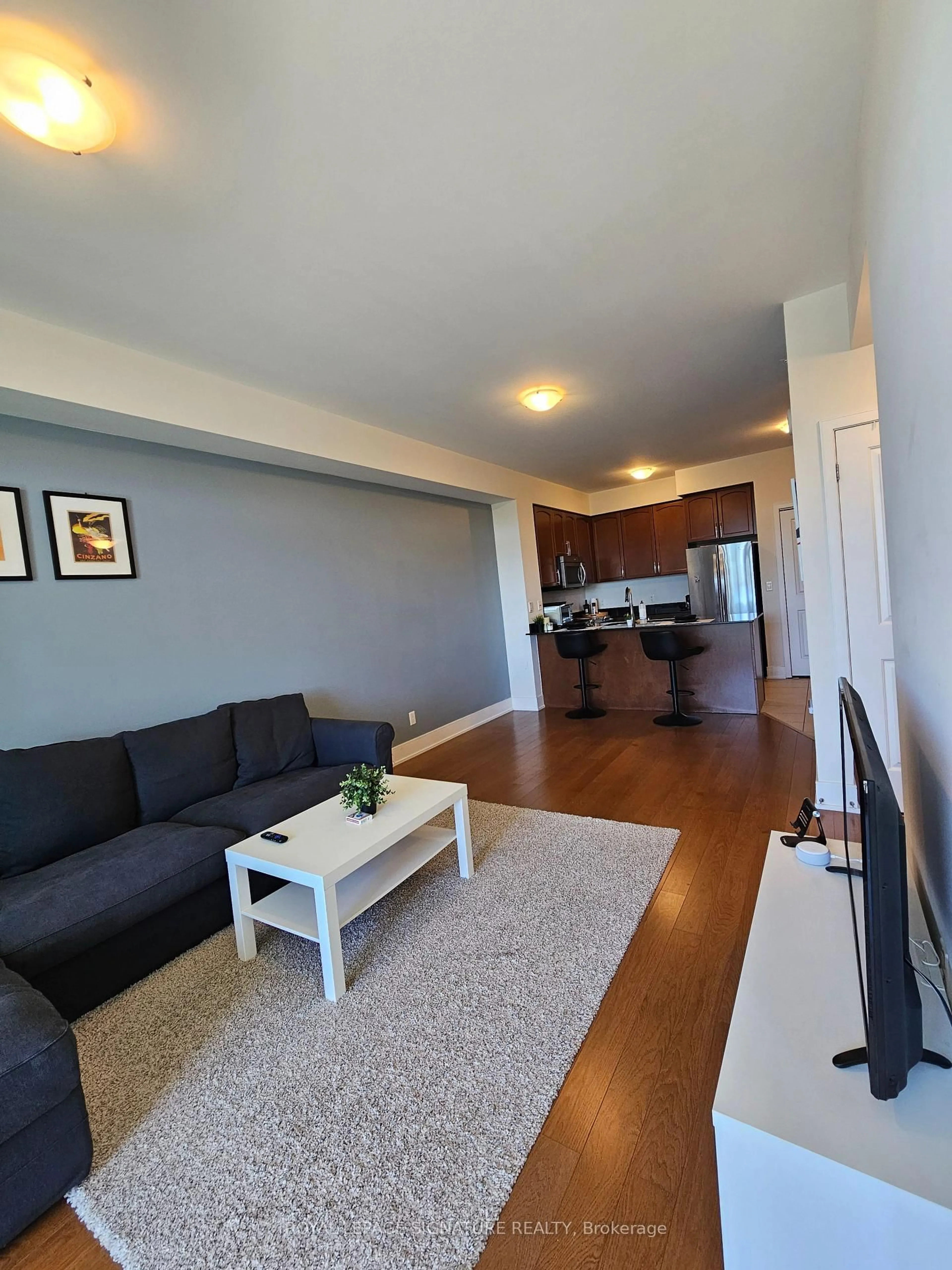 Living room with furniture, wood/laminate floor for 144 Park St #506, Waterloo Ontario N2L 0B6