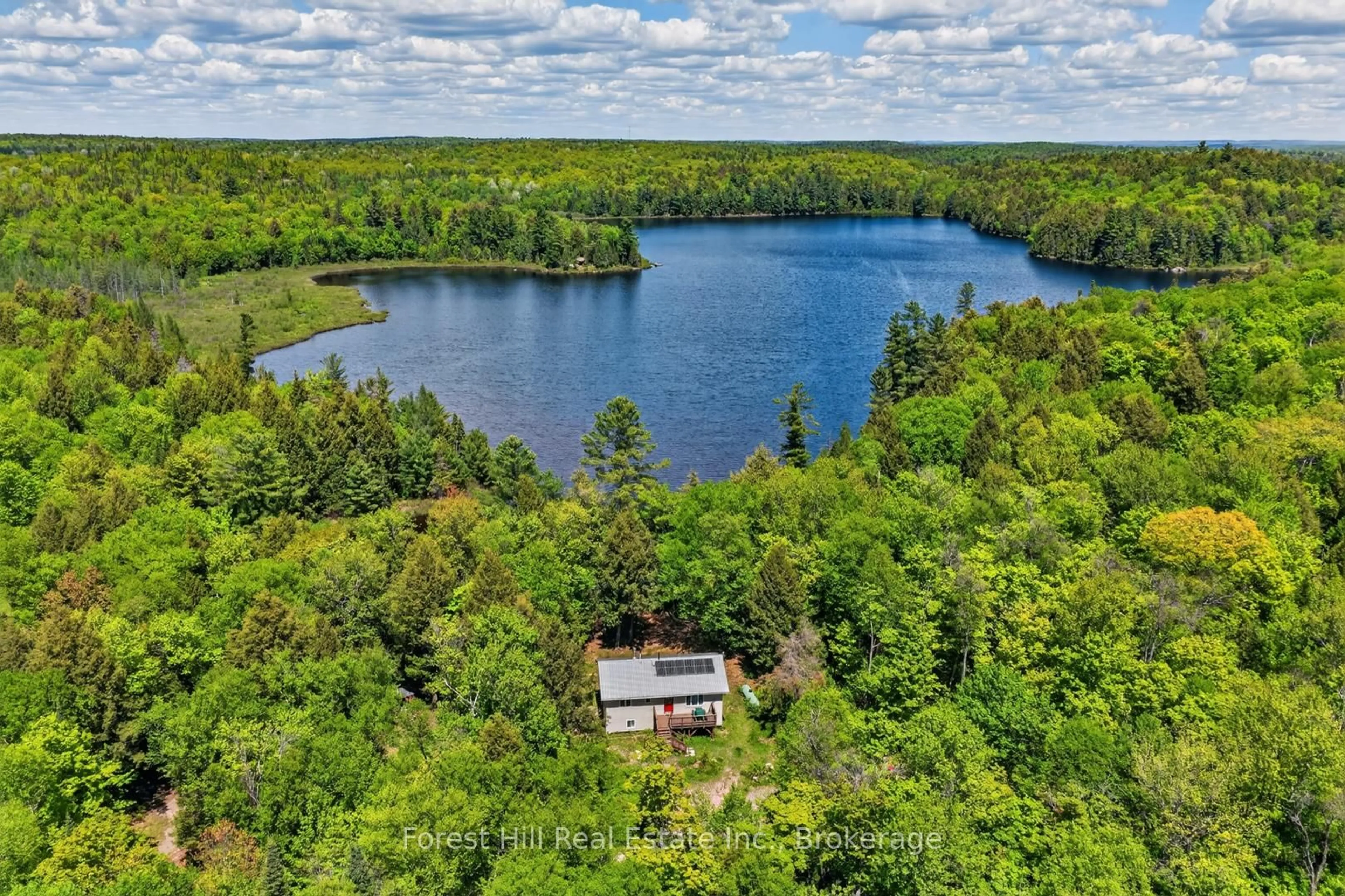 A pic from outside/outdoor area/front of a property/back of a property/a pic from drone, water/lake/river/ocean view for 439A Baker Rd, Magnetawan Ontario P0A 1C0